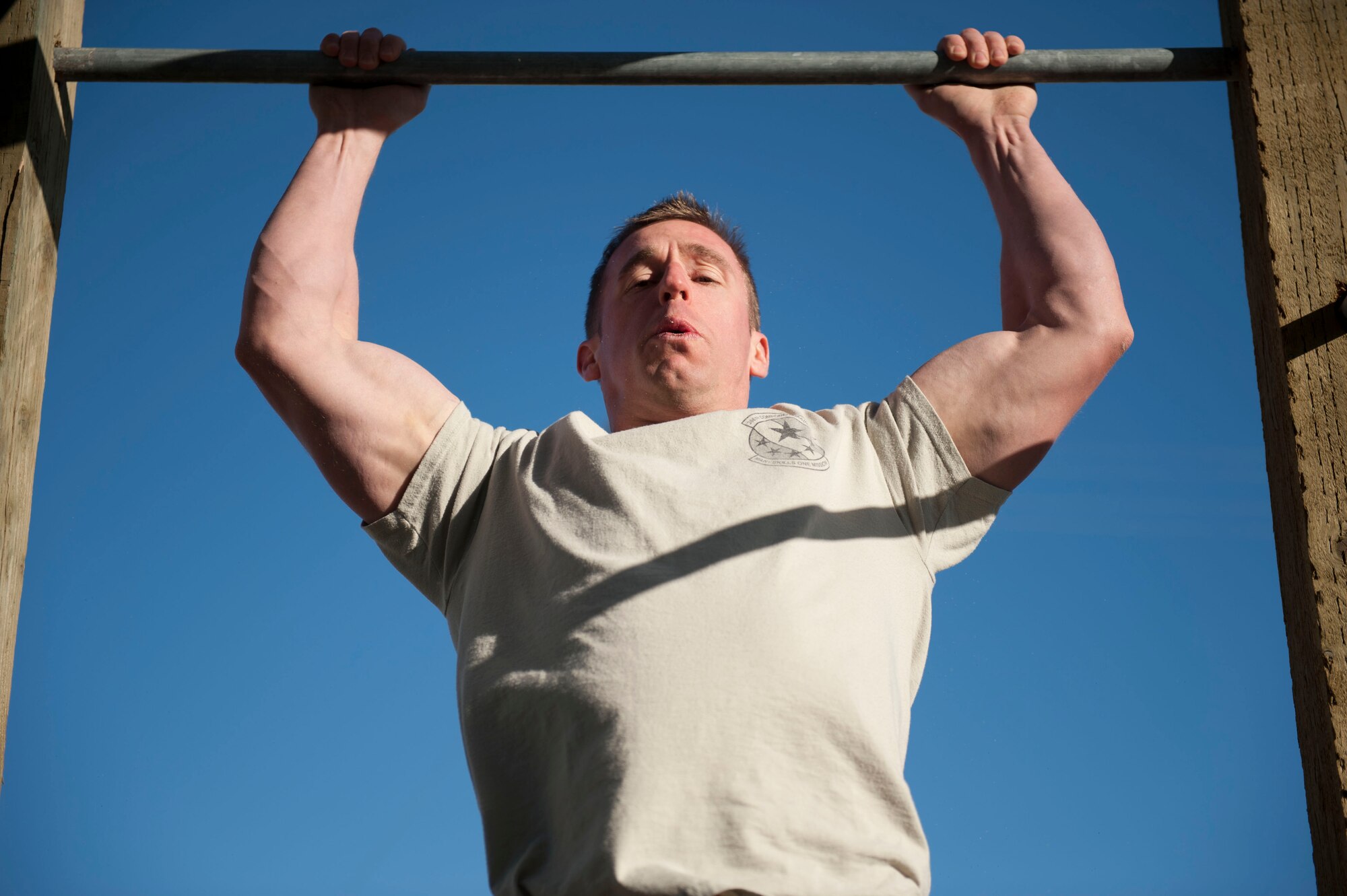 Master Sgt. Joshua Sebring, 366th Component Maintenance Squadron first sergeant, executes a pull up during the Defender Challenge May 13, 2014, at Mountain Home Air Force Base, Idaho. May 12-16 marks the 2014 Police Week, a week celebrating police forces serving in America. (U.S. Air Force photo by Airman 1st Class Malissa Lott/RELEASED)