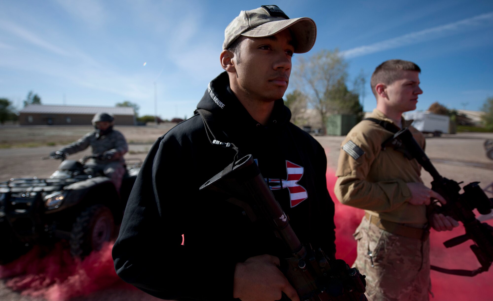 Senior Airman Terrel Minor, 366th Security Forces Squadron joint drug enforcement team, and Senior Airmen Daniel Shelor, 366th SFS staff armorer, stand with their weapons, May 13, 2014, at Mountain Home Air Force Base, Idaho. During Police Week, Airmen participate in various activities to show support for their Defenders. (U.S. Air Force photo by Airman 1st Class Malissa Lott/RELEASED)