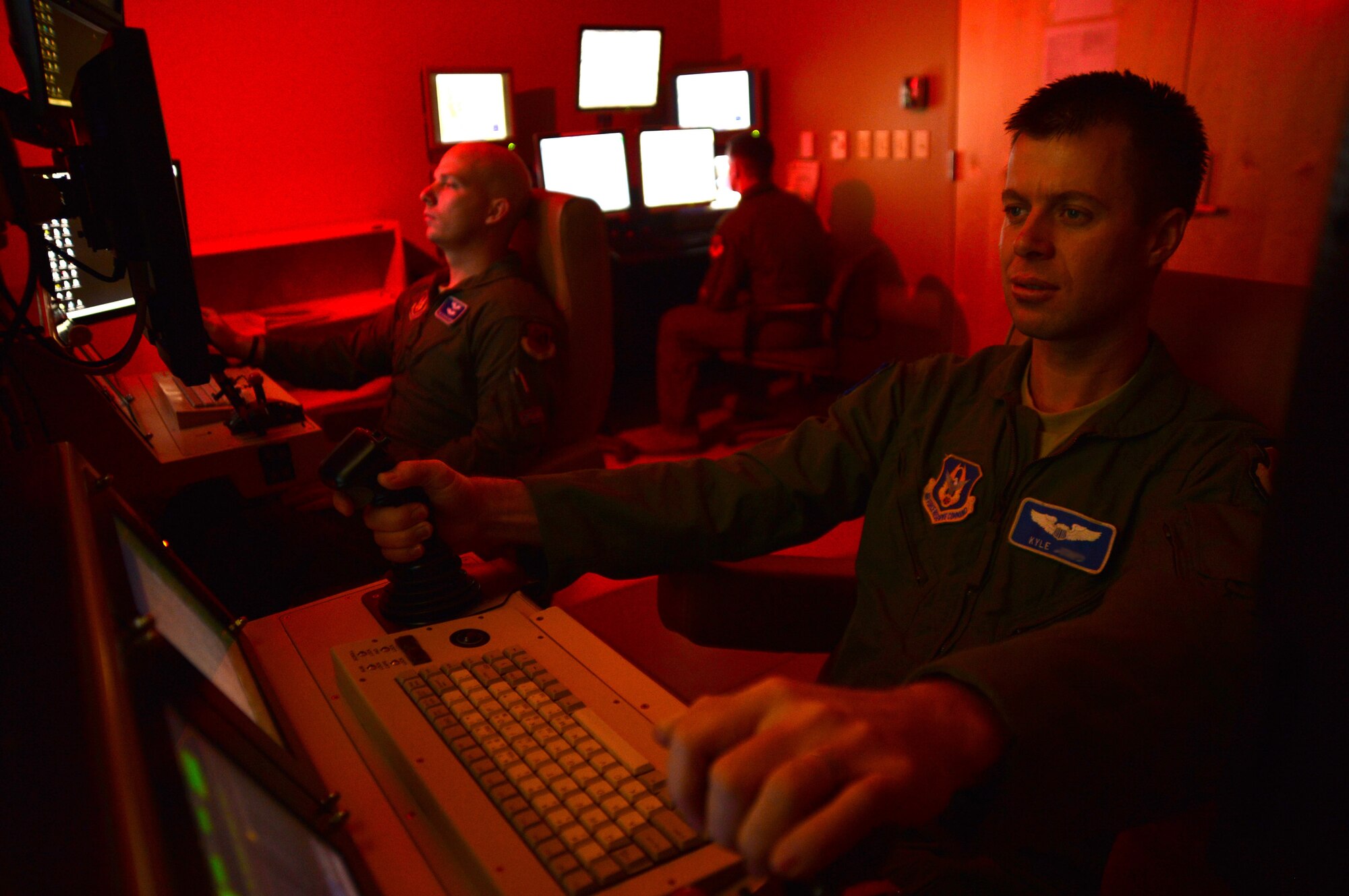A remotely piloted aircraft crew from the 91st Attack Squadron, flies a simulated training mission on an MQ-9 Reaper at Creech Air Force Base, Nev., May 8, 2014. The 91st ATKS was recently awarded the 2013 Grover Loening Trophy, which represents the current benchmark for the nation’s overall outstanding aviation program. (U.S. Air Force illustration by Staff Sgt. N.B./Released)
