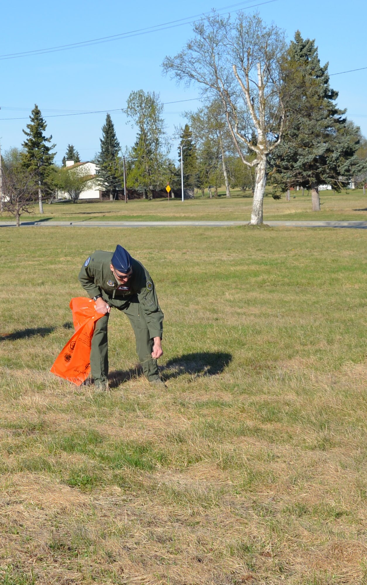Col. David Piffarerio, 477th Fighter Group deputy commander, picks up trash during the 477th Fighter Group, Alaska's only Air Force Reserve unit, participated in the Anchorage Chamber of Commerce citywide cleanup May 9. 

"With a sense of pride and respect, we join our community partners to clean up JBER and the Anchorage community," said Piffarerio."Alaska is by far one of the most beautiful places in the world and we should all do our part to keep it that way."
(U.S. Air Force/Capt. Ashley Conner) 

(U.S. Air Force/Capt. Ashley Conner)