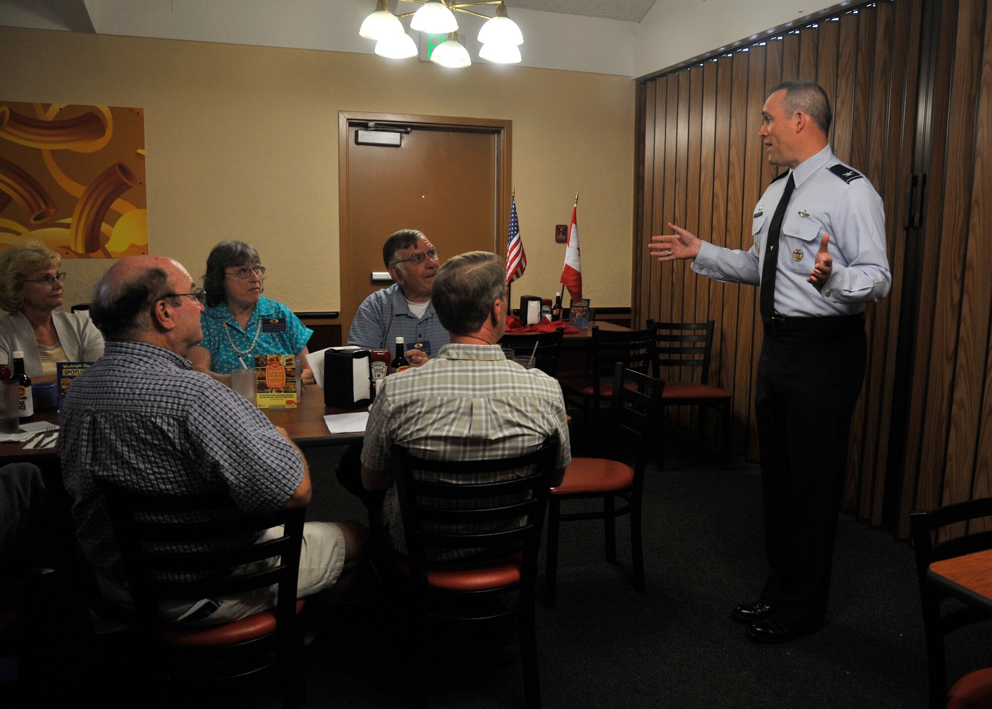 Col. Brian Newberry speaks with Kiwanis members from Spokane Valley, Spokane north and Deer Park, Wash., during a lunch in Spokane, Wash., May 13, 2014.  During his visit, Newberry spoke of the importance of Fairchild Air Force Base’s surrounding communities and the day-to-day mission of the base. Kiwanis club members work together all year long, building playgrounds, volunteering at local shelters, stocking shelves at food pantries and more. Individuals of every age are invited to join. Newberry is the 92nd Air Refueling Wing commander. (U.S. Air Force photo by Senior Airman Mary O’Dell/Released)