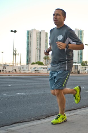 U.S. Air Force Col. Marcus Cranston, 99th Medical Group director of medical education endocrinology and preventive medicine, starts a four mile run May 7, 2014, in Las Vegas. Cranston ran four miles in 44 countries in four weeks to raise awareness for Parkinson's disease that began April 4, 2014. Cranston's first run began in Mongolia and his last run ended in Las Vegas. (U.S. Air Force photo by Senior Airman Christopher Tam)


