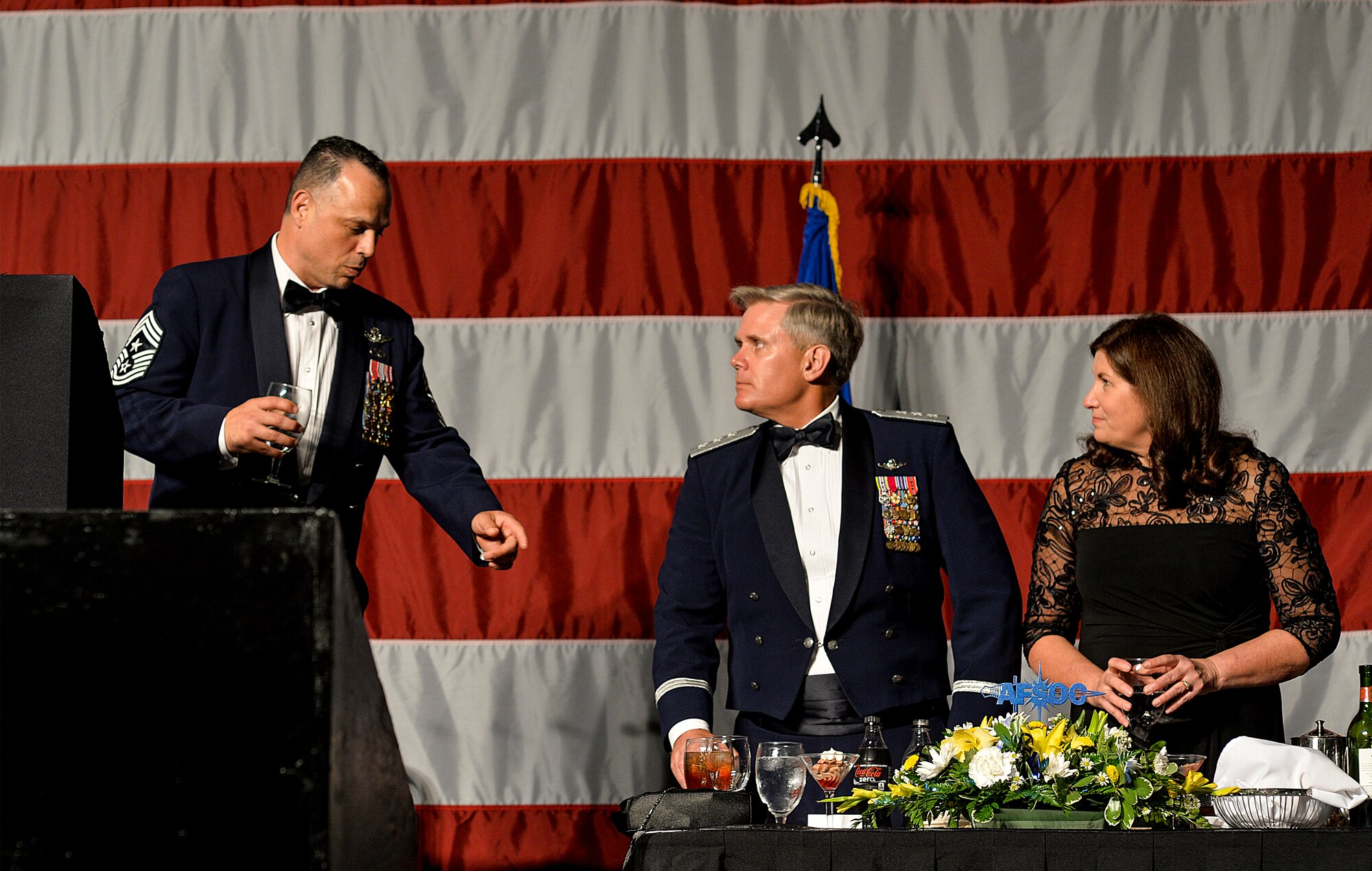 Chief Master Sgt. Matthew Caruso, Air Force Special Operations Command command chief, speaks to Lt. Gen. Eric Fiel, AFSOC commander, and Donna Fiel, during an Order of the Sword ceremony at the Emerald Coast Convention Center in Fort Walton Beach, Fla., May 9, 2014. Fiel was the ninth officer inducted into AFSOC’s Order of the Sword. (U.S. Air Force photo/Senior Airman Christopher Callaway)