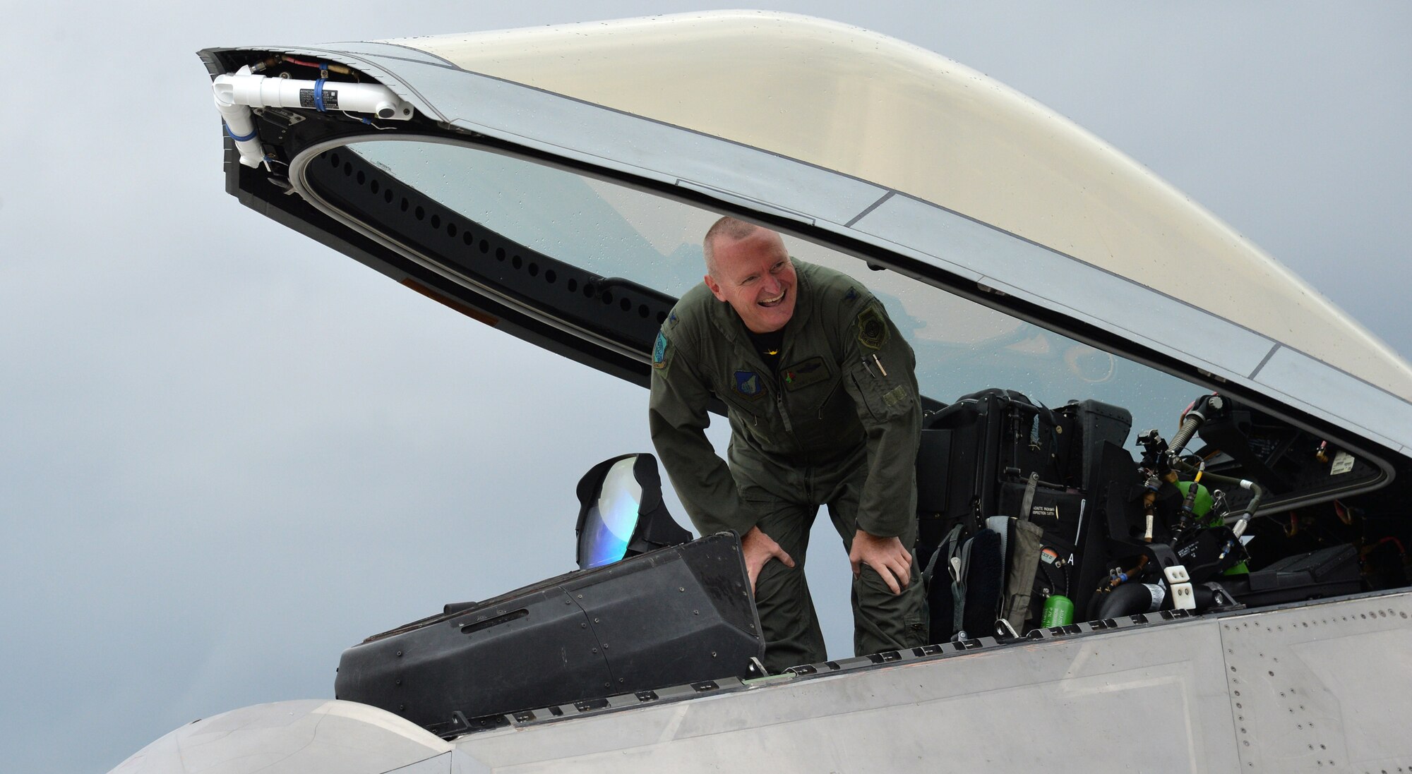 Col. Terry Scott, 15th Wing vice commander, greets friends, family and coworkers after a training mission at Joint Base Pearl Harbor-Hickam, Hawaii, May 9, 2014. The mission was Scott’s “fini-flight,” a ceremonial final flight for Air Force pilots. Scott is retiring after 33 years of enlisted and commissioned service.  (U.S. Air Force photo/Staff Sgt. Alexander Martinez)
