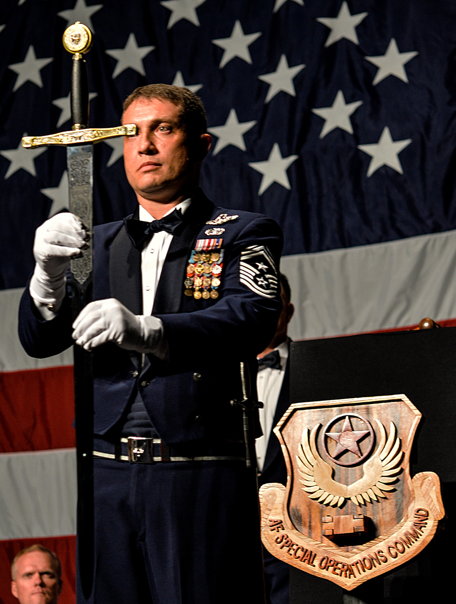 Chief Master Sgt. Joseph Montgomery, 353rd Special Operations Group command chief, presents the sword during an Order of the Sword ceremony at Emerald Coast Convention Center in Fort Walton Beach, Fla., May 9, 2014. Lt. Gen. Eric Fiel, Air Force Special Operation Command commander, was the ninth officer inducted into AFSOC’s Order of the Sword. (U.S. Air Force photo/Senior Airman Christopher Callaway)