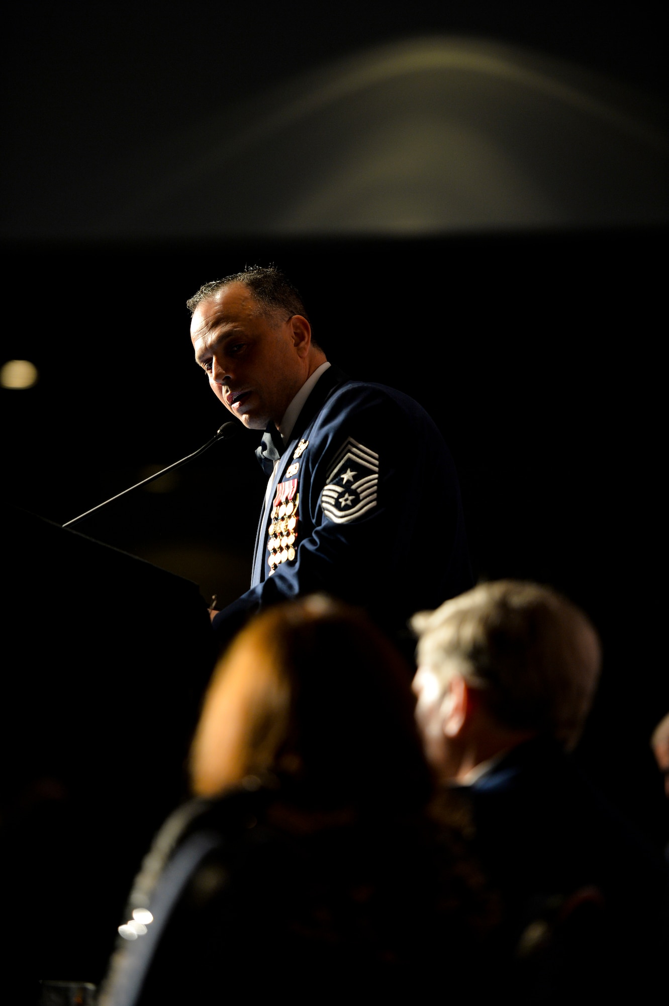 Chief Master Sgt. Matthew Caruso, Air Force Special Operations Command command chief, speaks during an Order of the Sword ceremony at the Emerald Coast Convention Center in Fort Walton Beach, Fla., May 9, 2014. Lt. Gen. Eric Fiel, AFSOC commander, was the ninth officer inducted into AFSOC’s Order of the Sword. (U.S. Air Force photo/Senior Airman Christopher Callaway)