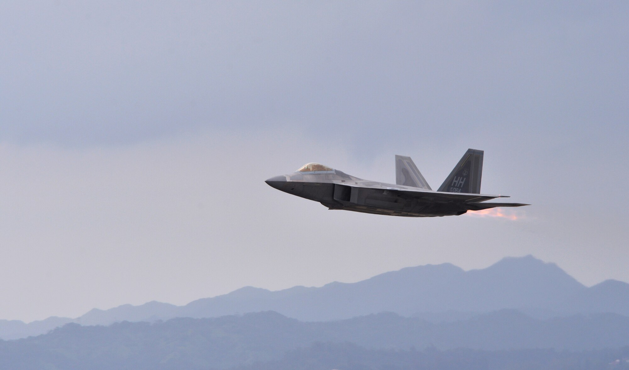 An F-22 Raptor controlled by Col. Terry Scott, 15th Wing vice commander, takes off for a training mission at Joint Base Pearl Harbor-Hickam, Hawaii, May 9, 2014. The mission was Scott’s “fini-flight,” a ceremonial final flight for Air Force pilots. Scott is retiring after 33 years of enlisted and commissioned service. (U.S. Air Force photo/Staff Sgt. Alexander Martinez)