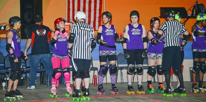 Master Sergeant Shanti Leiker, 22nd Communications Squadron first sergeant, gets her safety gear inspected before a roller derby game May 1, 2014, at Wichita, Kan. Her team, Heartland Havoc, practices three time a week and travels throughout the Midwest to compete. (U.S. Air Force photo/Airman 1st Class John Linzmeier)