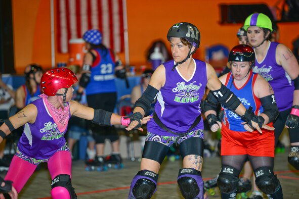 Master Sergeant Shanti Leiker, 22nd Communications Squadron first sergeant, skates at a roller derby game, May 1, 2014, at Wichita, Kan. She is the Heartland Havoc’s only active duty service member and skates under the track name, “Diamond Sk8ter,” originating from the first sergeant diamond patch on her military uniform. (U.S. Air Force photo/Airman 1st Class John Linzmeier)