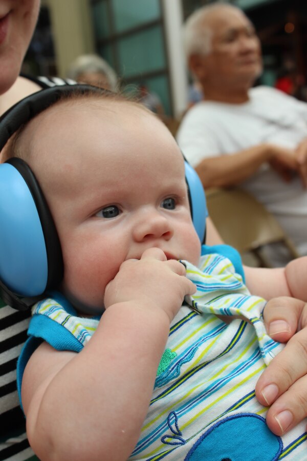 KAHULUI, Maui, Hawaii - Unanimously voted cutest audience member, Logan Plank (son of Senior Airman Brian Plank) enjoys Hana Hou's performance, smartly protecting his ears from the epic wall of sound.
(US Air Force Photos/TSgt Michael Smith/Released)