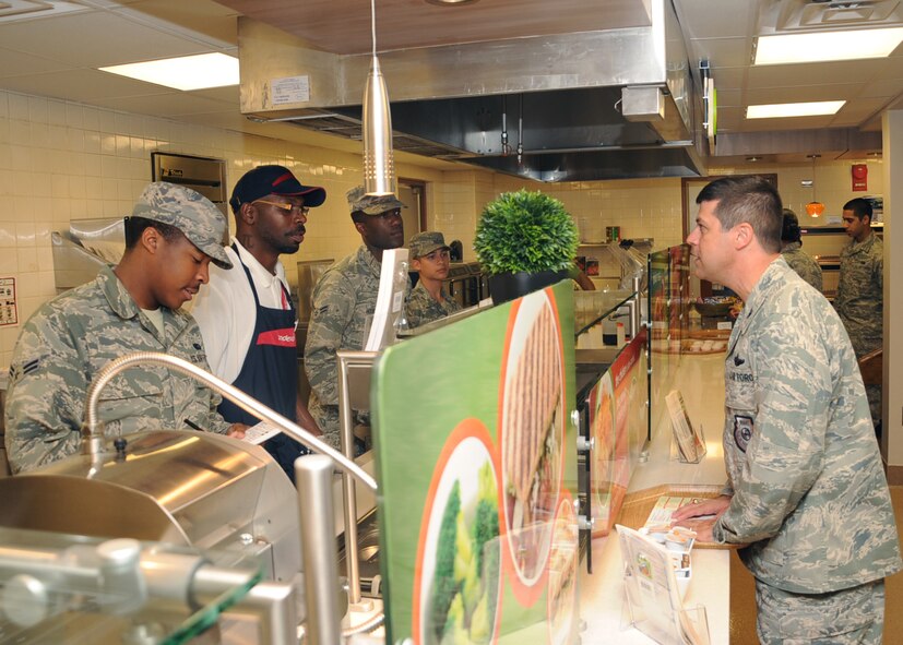 Col. Andrew Gebara, 2nd Bomb Wing commander, places an order at the Red River Dining Facility on Barksdale Air Force Base, La., May 13, 2014. The dining facility offers a variety of food choices to include a panini station, mongolian barbeque station and a smoothie station. (U.S. Air Force photo/Staff Sgt. Sean Martin)