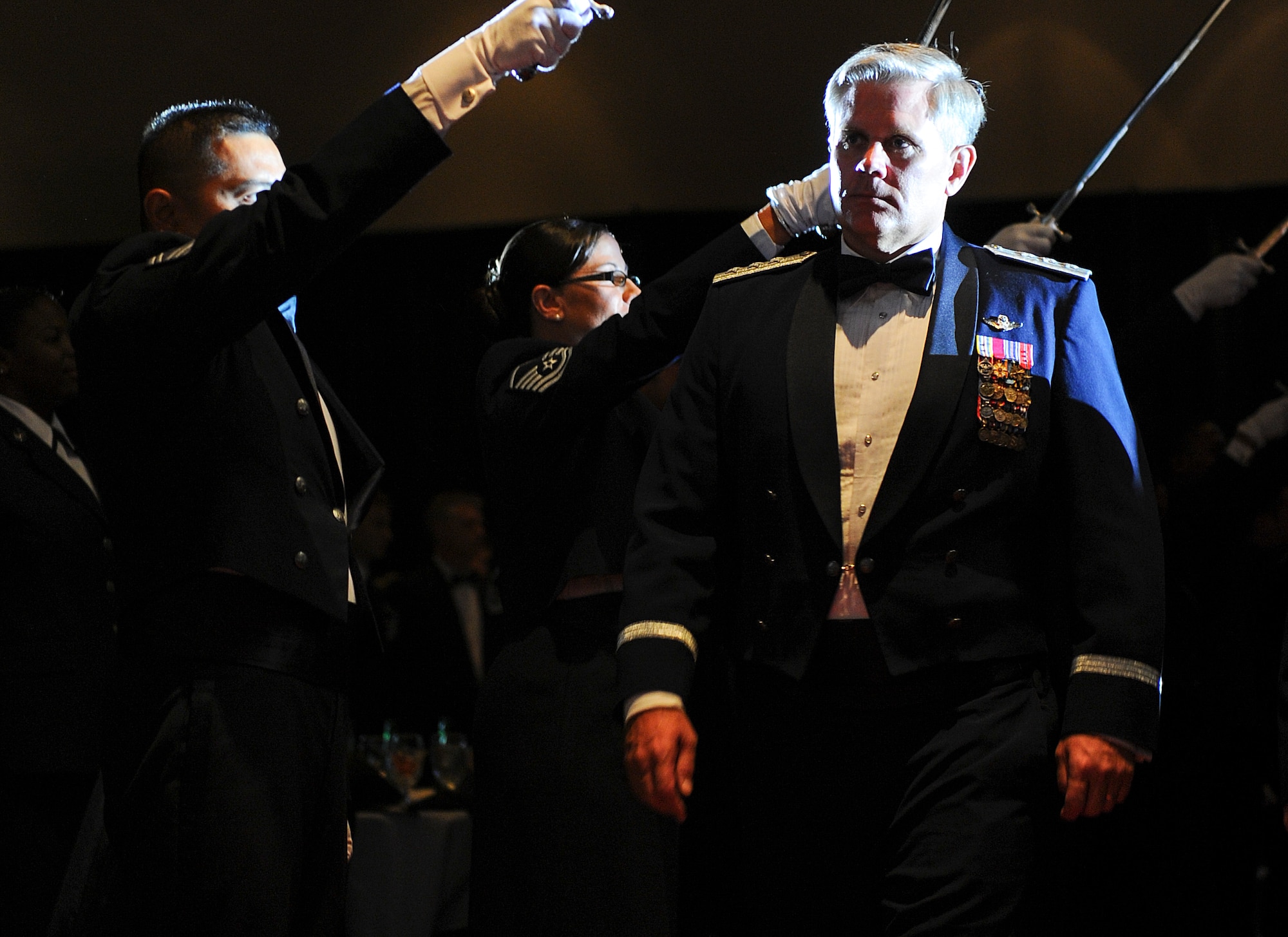 Lt. Gen. Eric Fiel, Air Force Special Operations Command commander, walks through the cordon to the head table at the Emerald Coast Convention Center in Fort Walton Beach, Fla., May 9, 2014. More than 500 enlisted Airmen honored Fiel at his Order of the Sword ceremony. (U.S. Air Force photo/Airman 1st Class Jeff Parkinson) 