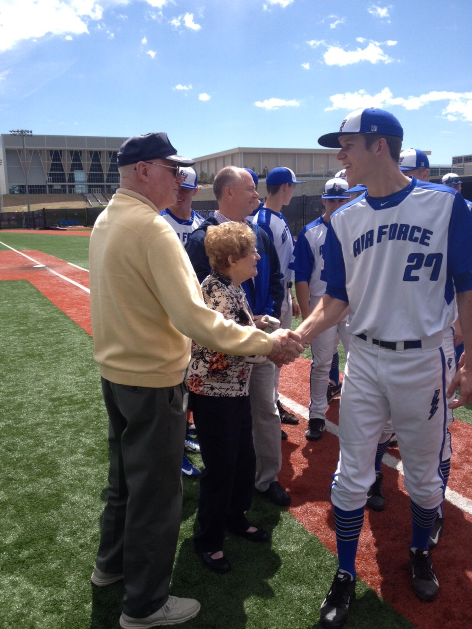Retired Col. Don Mueller shakes hands with Falcon Baseball player Nathan Stanford here. Mueller, and his wife Pat, are longtime supporters of the Academy and have sponsored countless Falcon Baseball players since the early 80s. (Courtesy photo)
