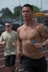 U.S. Air Force Staff Sgt. Michael Morris, 723d Aircraft Maintenance Squadron running team, competes with his team in the Inaugural Tiger Run in Valdosta, Ga., May 10, 2014. Teams of 10 participants or less were required to have at least one runner on the track for the entire 12 hours.
 (U.S. Air Force photo by Airman Dillian Bamman/Released)
