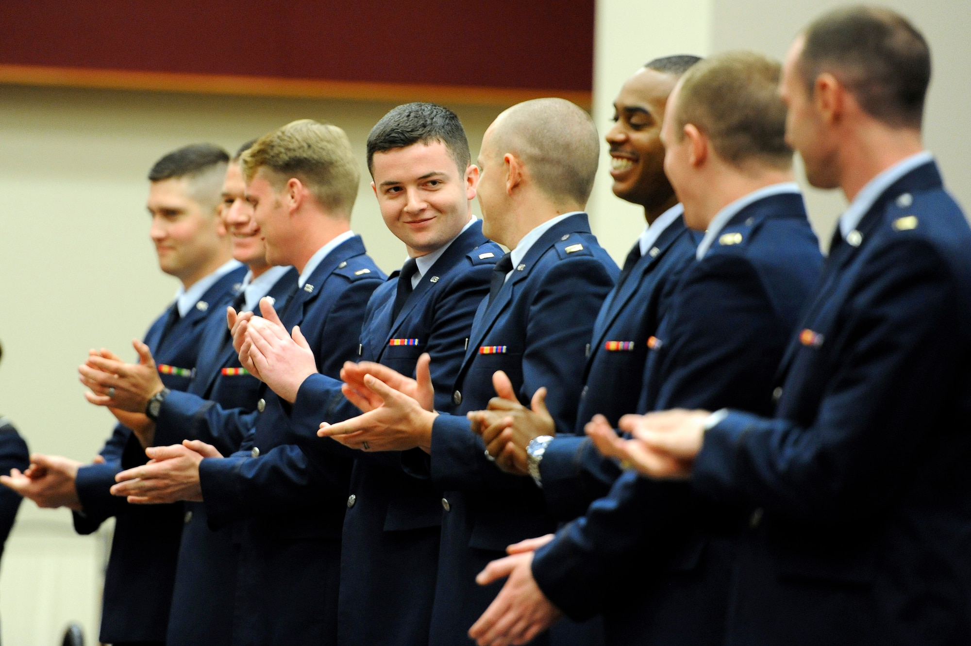 SAN ANGELO, Texas – Second lieutenants join the audience in a round of applause to commence their commissioning ceremony at Angelo State University May 9. ASU Air Force ROTC Detachment 847 has commissioned more than 600 officers since its inception in 1971. (U.S. Air Force photo/ Staff Sgt. Austin Knox)