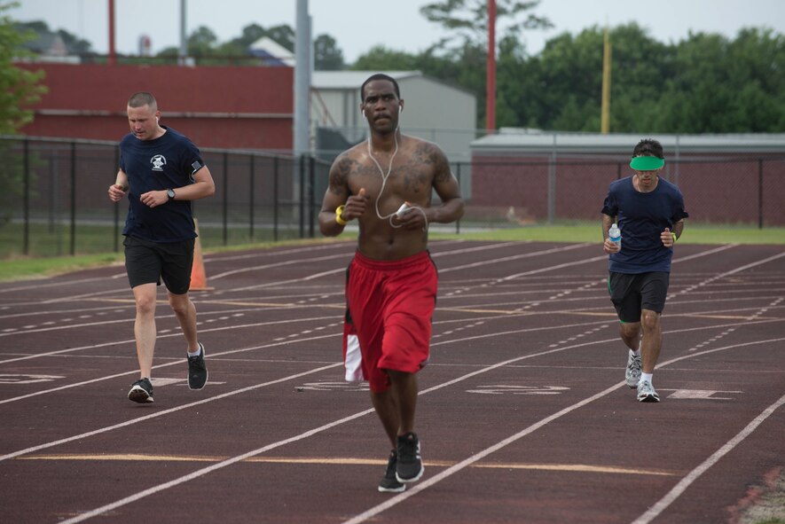 Participants run laps around Lowndes High School’s track for the Inaugural Tiger Run in Valdosta Ga., May 10, 2014. Participants ran more than 1,500 miles combined. (U.S. Air Force photo by Airman Dillian Bamman/Released)