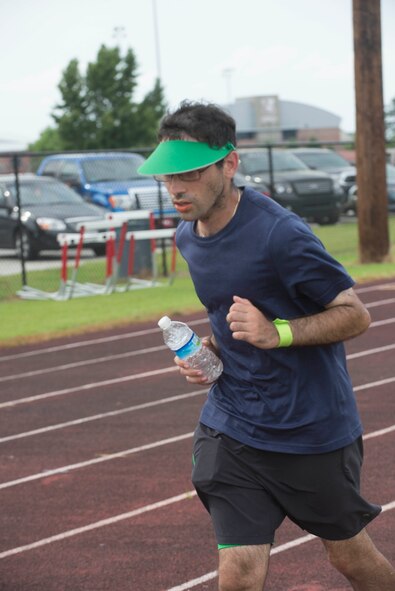 Robert Colon, an individual competitor that traveled from North Carolina, runs for the Inaugural Tiger Run in Valdosta, Ga., May 10, 2014. Colon stayed on the track for the entire 12 hours and finished the competition with 53 miles on his own. (U.S. Air Force photo by Airman Dillian Bamman/Released)
