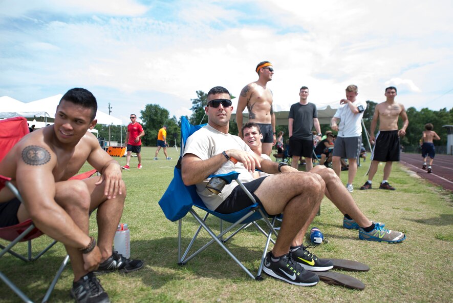 Safeside running team cheers on their runner during the Inaugural Tiger Run in Valdosta, Ga., May 10, 2014. Safeside finished the competition in 1st place, with a combined total of nearly 122 miles. (U.S. Air Force photo by Airman Dillian Bamman/Released)