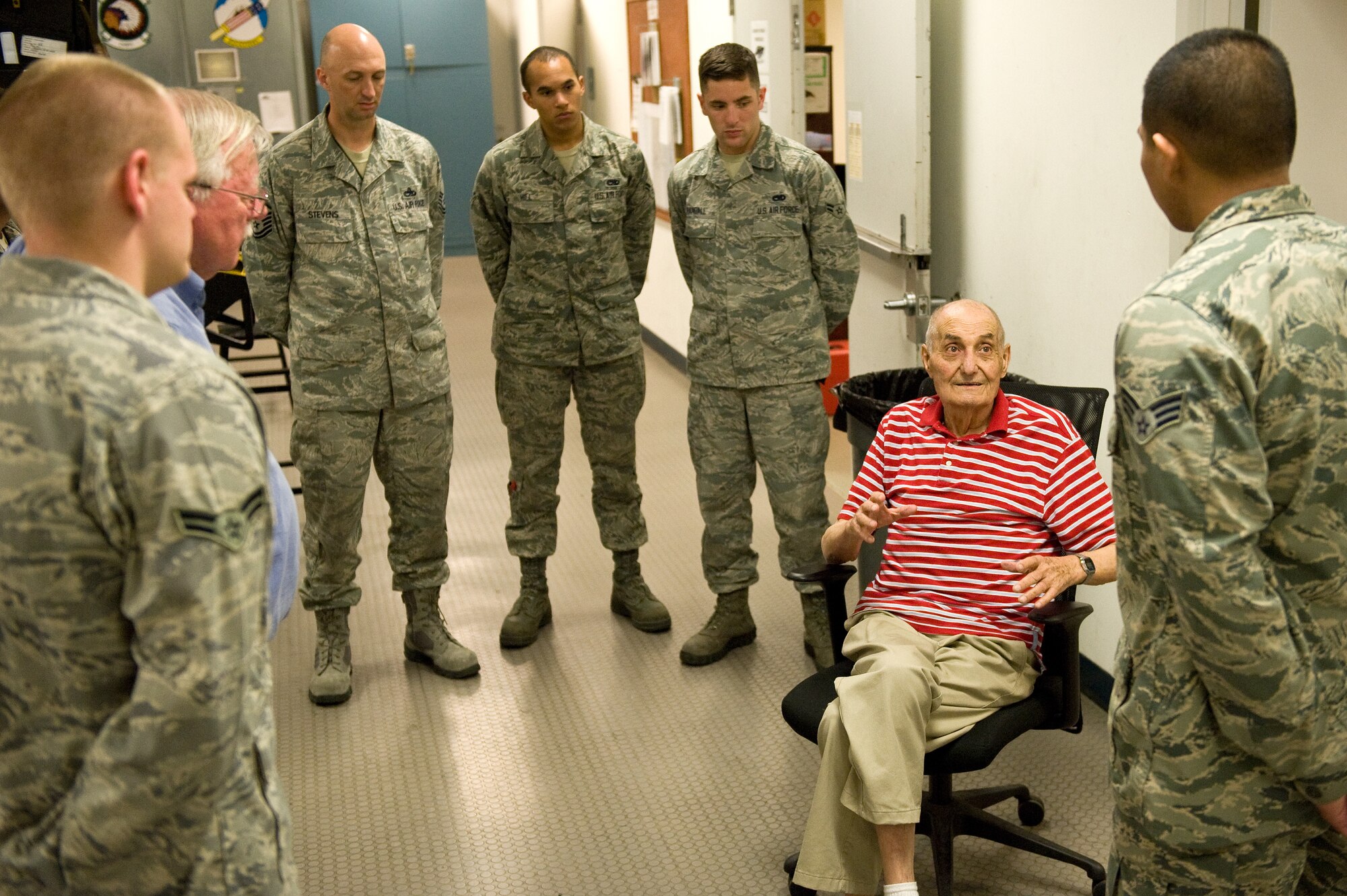 Retired Chief Master Sgt. George H. Fuller Sr., founder of the Air Force’s first egress shops, shares his experiences with 4th Component Maintenance Squadron Airmen during a tour, April 30, 2014, at Seymour Johnson Air Force Base, North Carolina. Fuller attended the first egress training in 1953 and started egress shops all over the Air Force. (U.S. Air Force photo/Airman 1st Class Aaron J. Jenne)