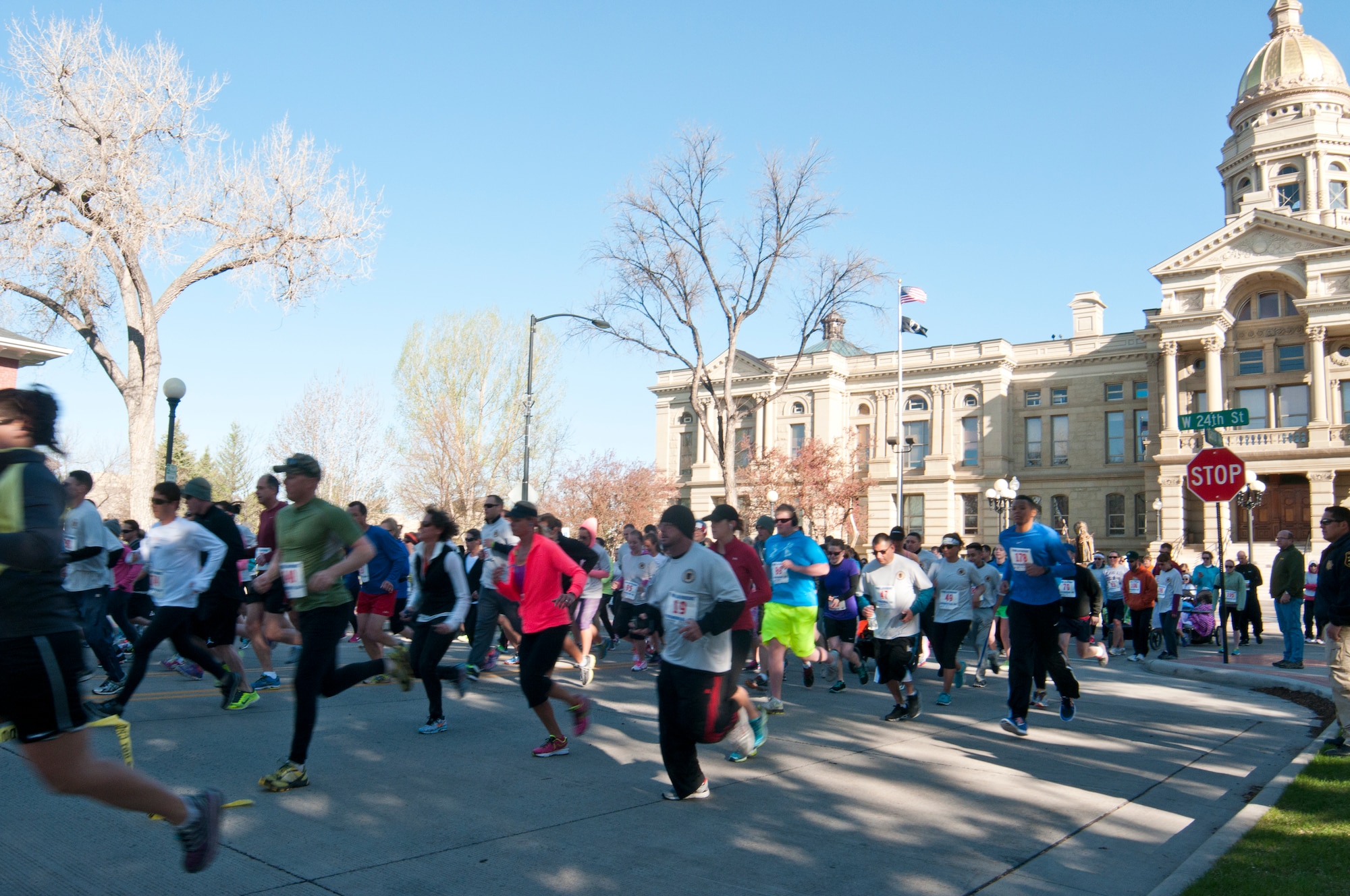 Members of the Cheyenne, Wyo., and F.E. Warren Air Force Base, Wyo., communities start running in the 2014 Wyoming Law Enforcement Memorial 5K, which weaved its way through downtown Cheyenne May 10, 2014. The race raised money to fund the building of a memorial to fallen Wyoming law enforcement officers. (U.S. Air Force photo by Airman 1st Class Jason Wiese)