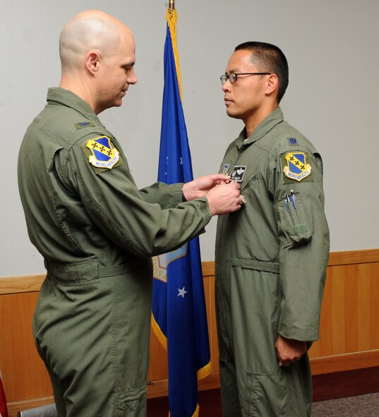 U.S. Air Force Col. Michael Bob Starr, left, 7th Bomb Wing commander, presents Lt. Col. Jose Sumangil, 9th Bomb Squadron commander, with the Bronze Star Medal May 13, 2014, at Dyess Air Force Base, Texas. As the commander of the 9th Expeditionary Bomb Squadron, Sumangil lead the unit which executed more than 540 combat missions in support of Operation Enduring Freedom from July 2013 to January 2014. (U.S. Air Force photo by Airman 1st Class Autumn Velez/Released)