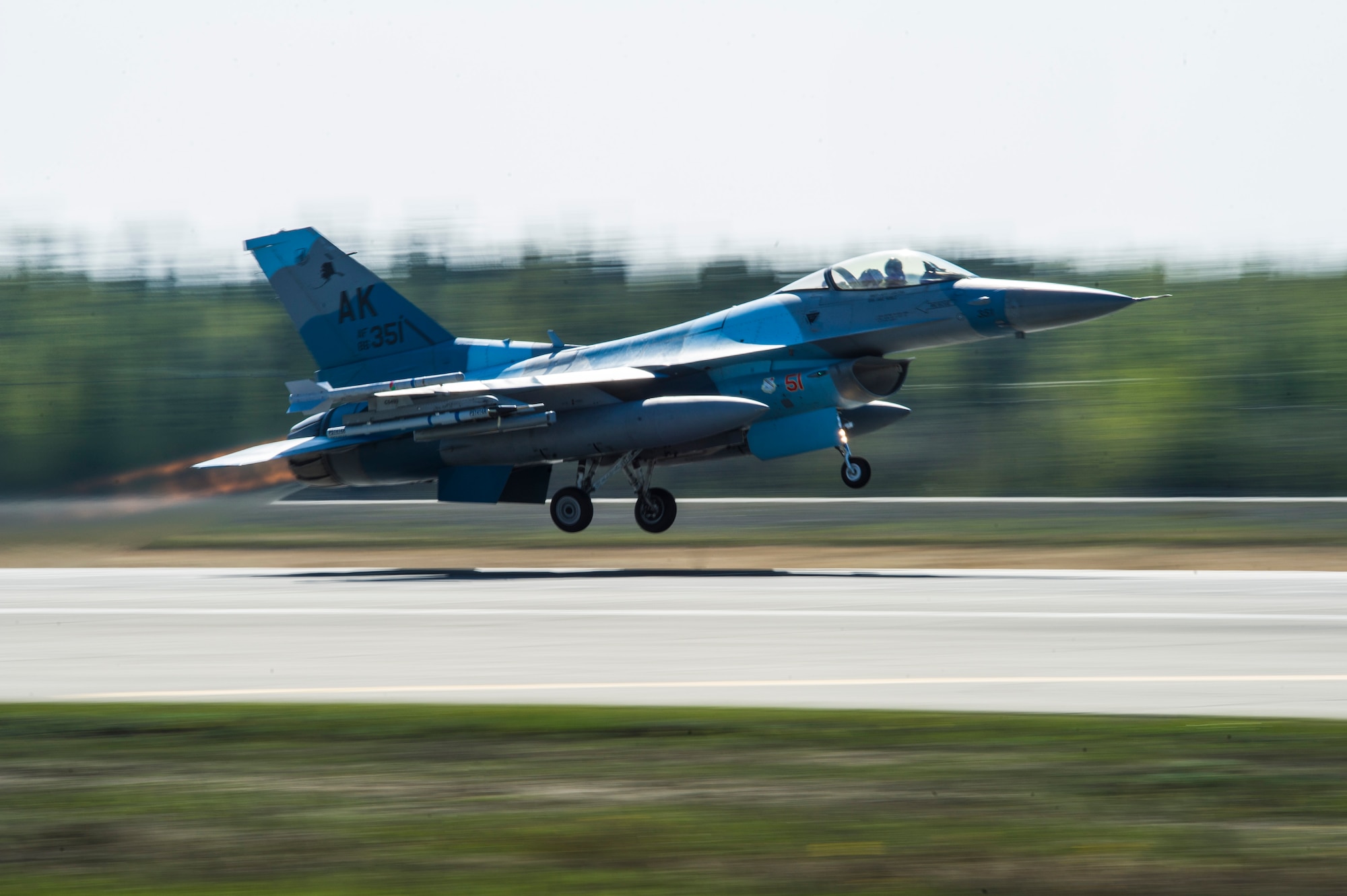 A U.S. Air Force F-16 Fighting Falcon assigned to the 18th Aggressor Squadron takes off during RED FLAG-Alaska 14-1 May 12, 2014, Eielson Air Force Base, Alaska. Aggressor pilots act as opposing forces in RF-A to prepare U.S. and allied forces for real-world aerial combat. (U.S. Air Force photo by Senior Airman Joshua Turner/Released)