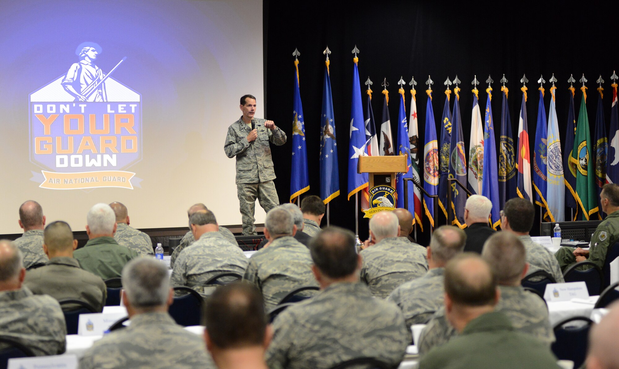 Lt. Gen. Stanley E. Clarke III, the director of the Air National Guard, delivers his welcome remarks to senior leaders during the 2014 Executive Safety Summit at Volk Field Combat Readiness Training Center, Wis., May 13, 2014. This year’s conference theme: “Leaders: Don’t Let Your Guard Down,” covers a wide range of topics including safety, resilience, diversity and mishap prevention. (U.S. Air National Guard photo by Senior Airman John E. Hillier/Released)