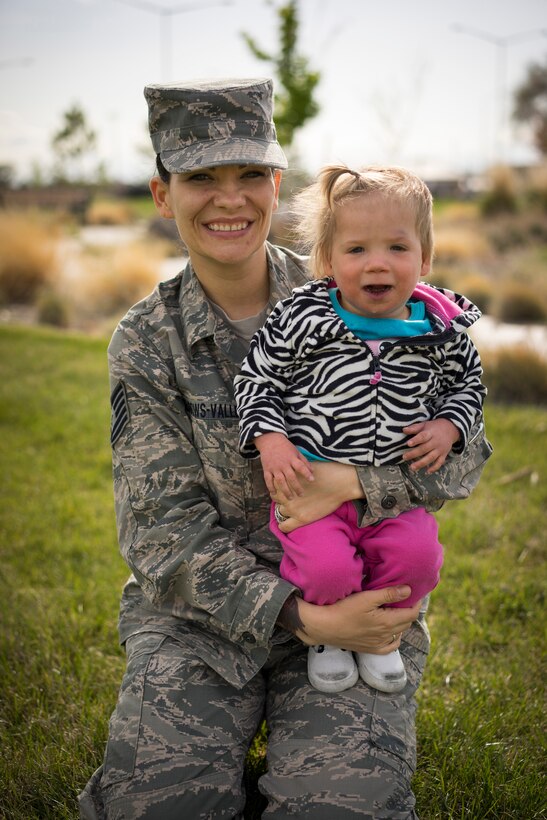 Tech. Sgt. Jamie Meadows-Valley, 366th Aerospace Medicine Squadron, poses for a photo with her newly adopted daughter Oleksandra at Mountain Home Air Force Base, Idaho, on May 6, 2014. (U.S. Air Force photo/Tech. Sgt. Samuel Morse)