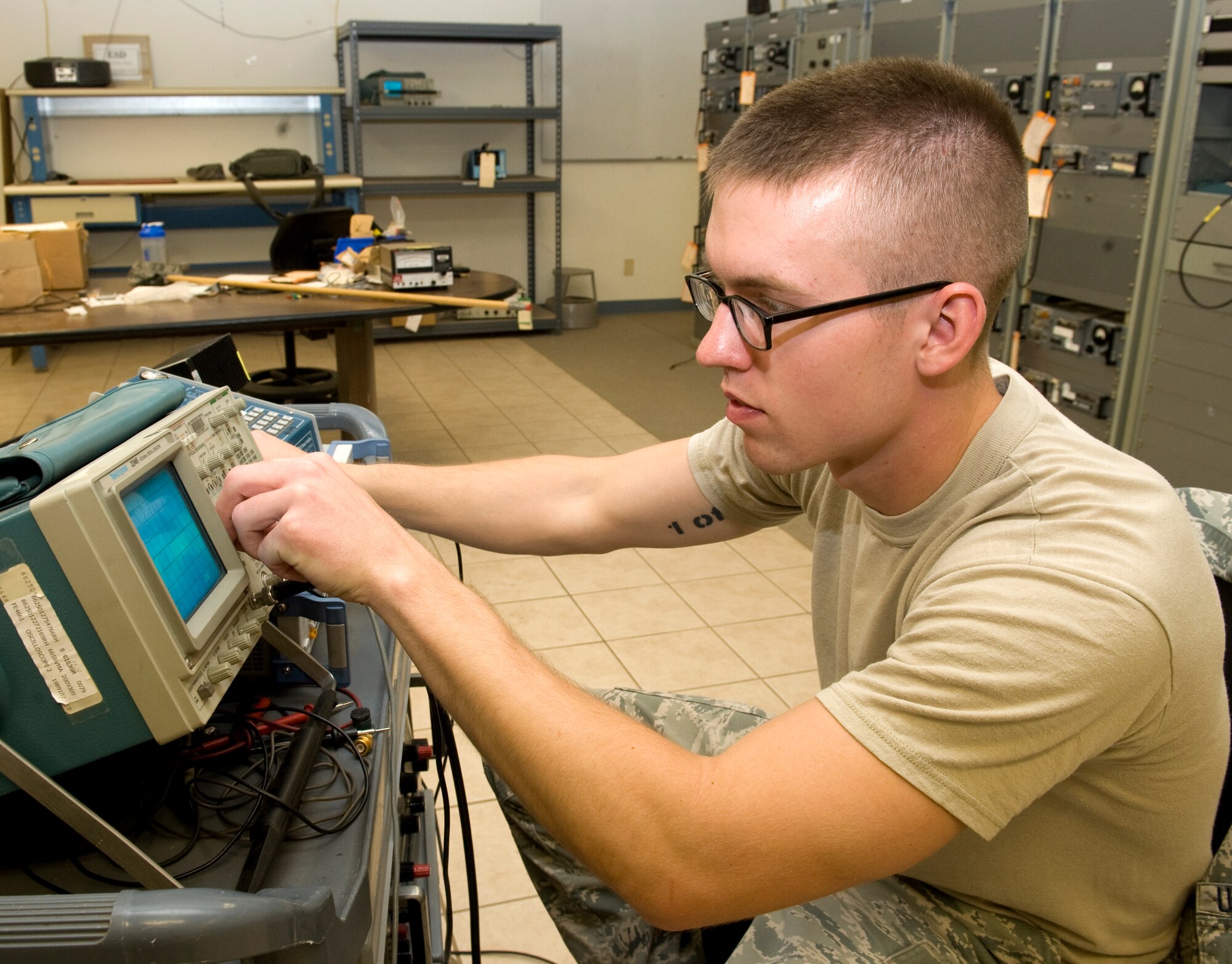 U.S. Air Force Senior Airman David Clement, 7th Communications Squadron airfield system technician, adjusts an oscilloscope May 9, 2014, at Dyess Air Force Base, Texas. Clement will be the first in his family of five military generations to become an officer if he is accepted to the United States Air Force Academy after completing the Academy’s 10-month long preparatory school. (U.S. Air Force photo by Airman 1st Class Autumn Velez/Released)