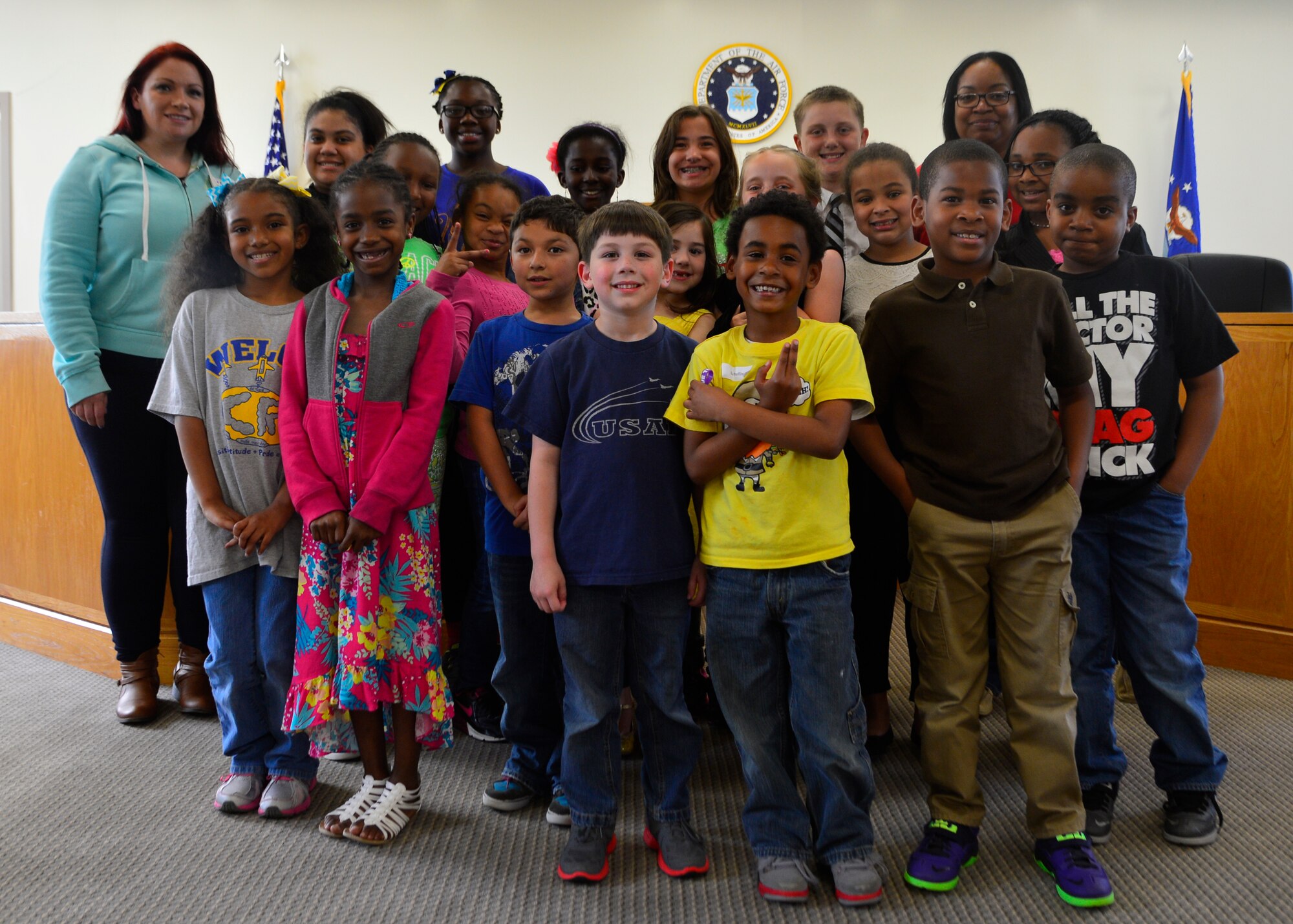 Children from the youth center pose for a group photo after conducting a mock trial of Goldilocks and the Three Bears May 2, 2014, at Dover Air Force Base, Del. The children portrayed different roles from the story as Goldilocks was prosecuted for stealing the bears’ porridge. (U.S. Air Force photo/Airman 1st Class William Johnson)