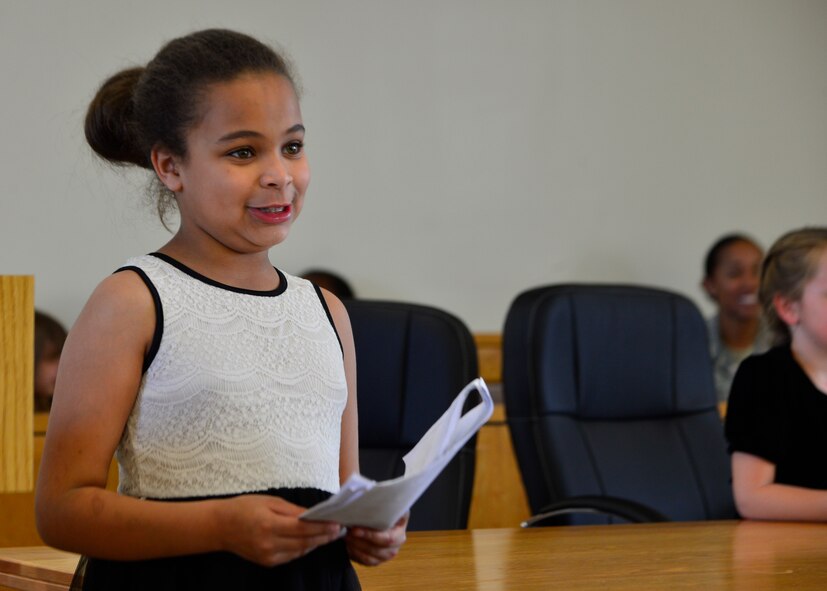 Alyssa Richmond, who portrayed a prosecutor, speaks to the judge during a mock trial of Goldilocks and the Three Bears May 2, 2014, at Dover Air Force Base, Del. Richmond and other children from the youth center played roles from the story Goldilocks and the Three Bears and participated in a mock trial of prosecuting Goldilocks for stealing the bears’ porridge. (U.S. Air Force photo/Airman 1st Class William Johnson)