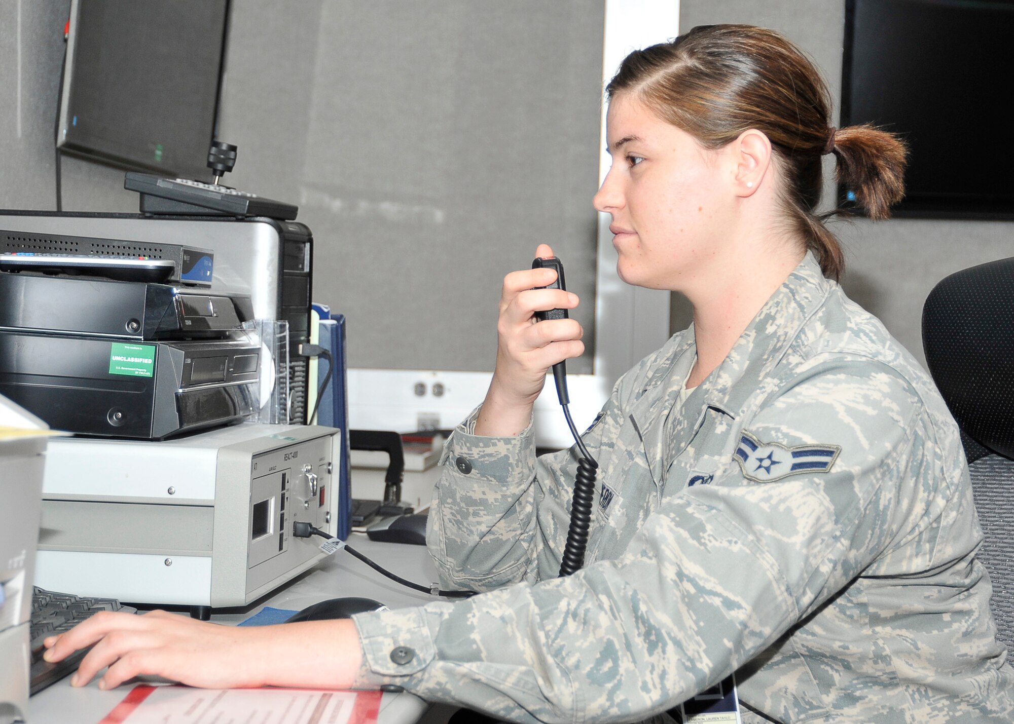 Airman 1st Class Lauren T. Cameron, Air Forces Northern-Tyndall Command Center emergency action controller, prepares to send out a message via Installation Warning System May 13 at the Command Post. The Installation Warning System is a form of mass notification to inform Airmen and their families of ongoing situations. (U.S. Air Force photo by Airman 1st Class Solomon Cook)