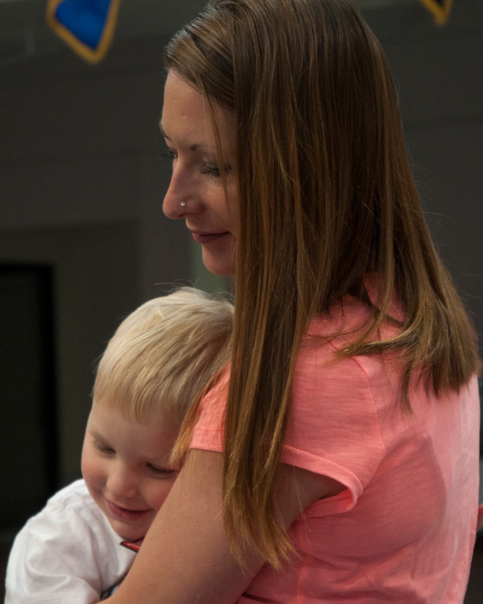 Shannon Beyea hugs her son, Travis, 2, May 10 during the Mommy and Me Tea and Craft event in the Fall Hall Community Center. This is the first time the event has been held. (U.S. Air Force photo by Airman Malcolm Mayfield)