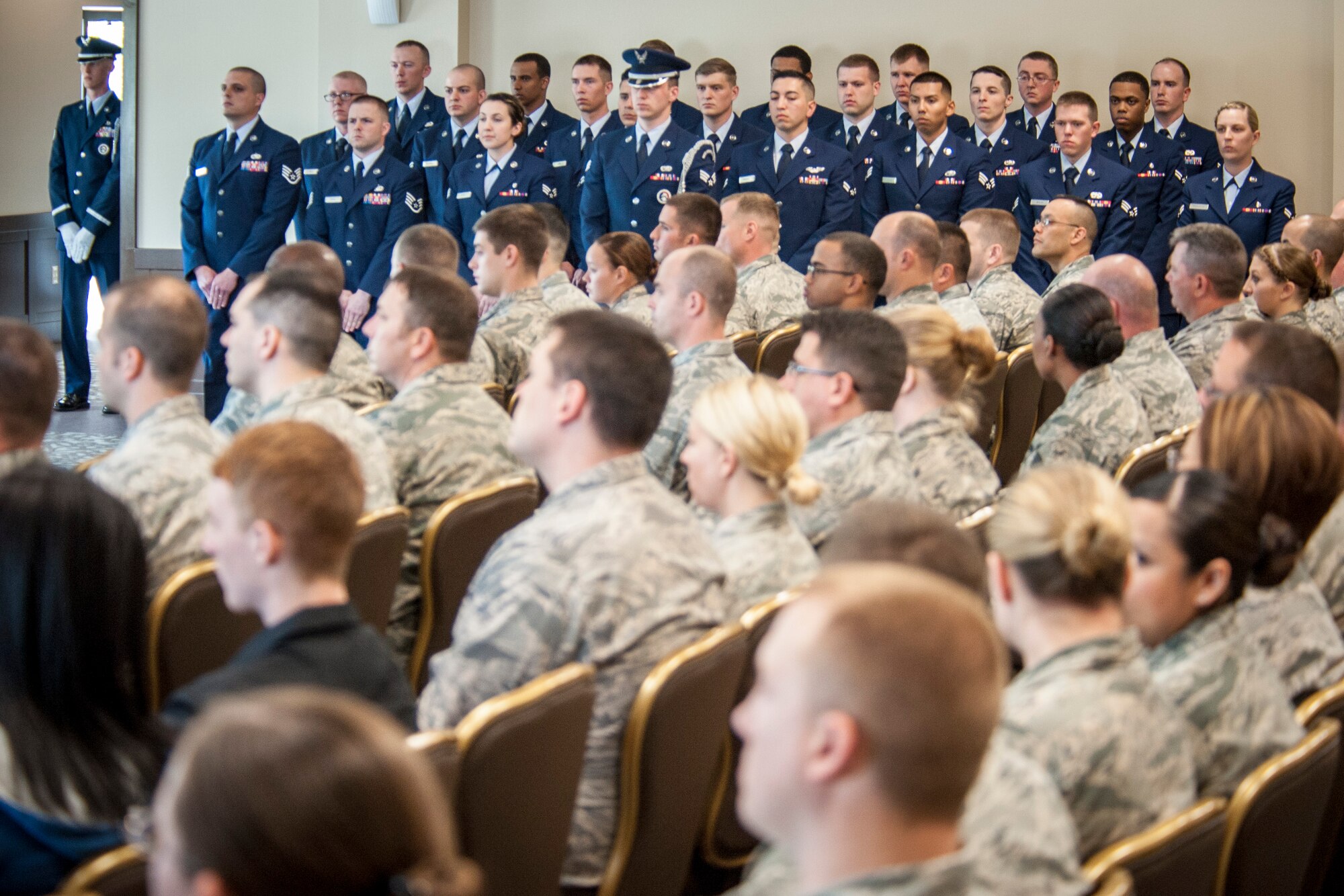 Fairchild Honor Guard members stand in formation during their honor guard graduation ceremony in the Red Morgan Event Center at Fairchild Air Force Base, Wash., May 9, 2014. Fairchild’s honor guard performs military honors for various events and ceremonies across the Inland Northwest every week as the installation’s front-line ambassadors. Each member from nearly every career field serves a four month rotation. (U.S. Air Force photo by Staff Sgt. Benjamin W. Stratton/Released)
