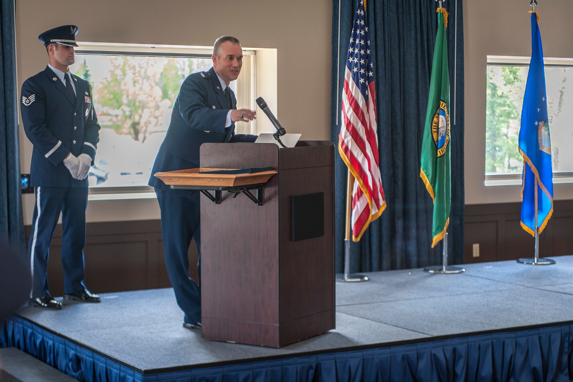 Col. Brian Newberry addresses Fairchild Honor Guard graduates and event attendees during an honor guard graduation ceremony in the Red Morgan Event Center at Fairchild Air Force Base, Wash., May 9, 2014. Fairchild’s honor guard performs military honors for various events and ceremonies across the Inland Northwest every week as the installation’s front-line ambassadors. Each member from nearly every career field serves a four month rotation. Newberry is the 92nd Air Refueling Wing commander. (U.S. Air Force photo by Staff Sgt. Benjamin W. Stratton/Released)