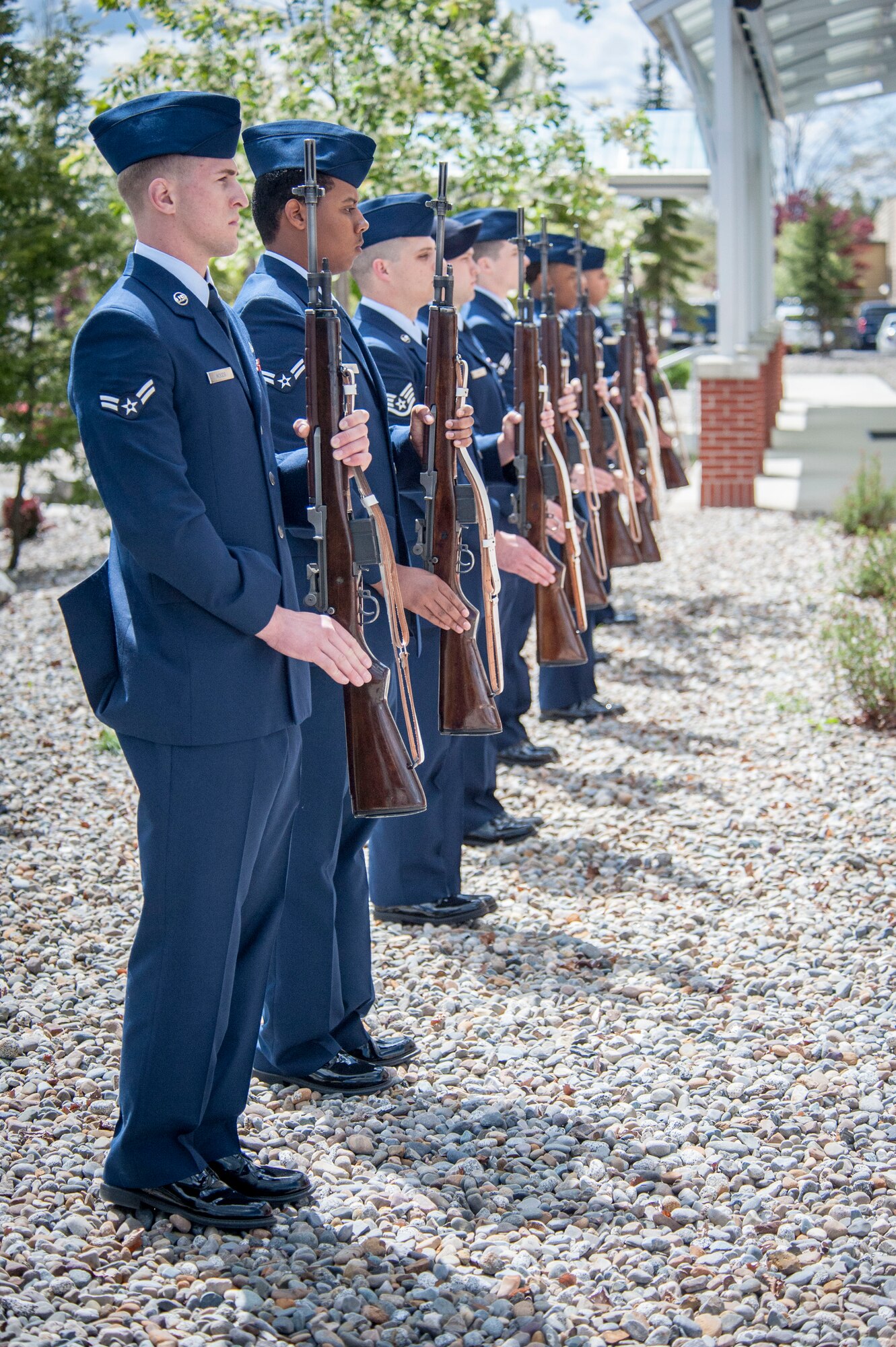 Fairchild Honor Guard graduates perform firing party duties as part of a military funeral presentation during their graduation ceremony in the Red Morgan Event Center at Fairchild Air Force Base, Wash., May 9, 2014. Fairchild’s honor guard performs military honors for various events and ceremonies across the Inland Northwest every week as the installation’s front-line ambassadors. Each member from nearly every career field serves a four month rotation. (U.S. Air Force photo by Staff Sgt. Benjamin W. Stratton/Released)