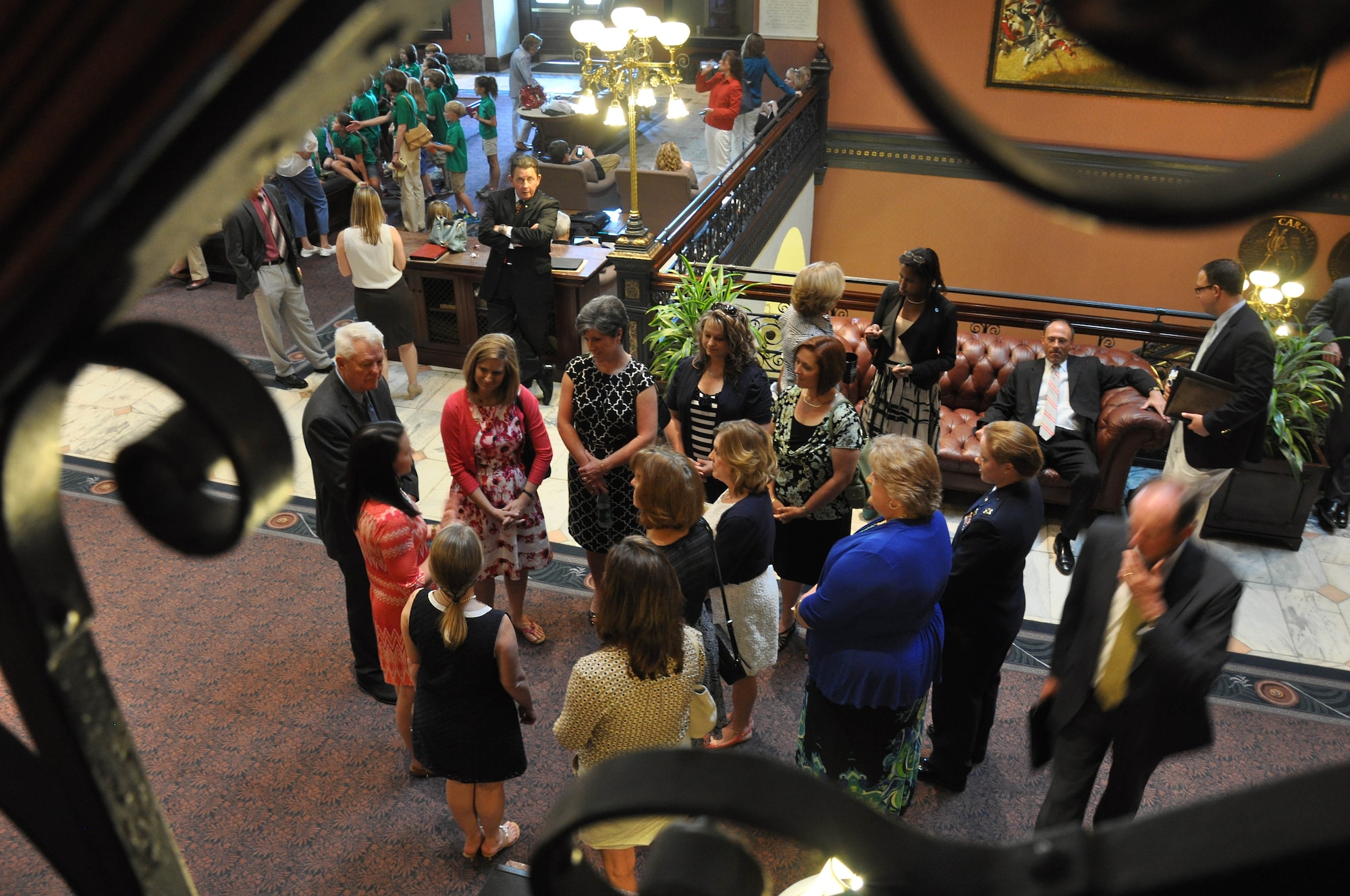 Leadership spouses from the 20th Fighter Wing, U.S. Air Forces Central Command, U.S. Army Central, and Ninth Air Force gather in the upper lobby of The State House, Columbia, S.C., during their tour, May 8, 2014. Military spouses from across the state were invited to The State House to attend S.C. Gov. Nikki Haley's proclamation reading and signing, which declared May 9, 2014, as "Military Spouse Appreciation Day in South Carolina."  (U.S. Air Force photo by Tech. Sgt. Ave Young/Released)