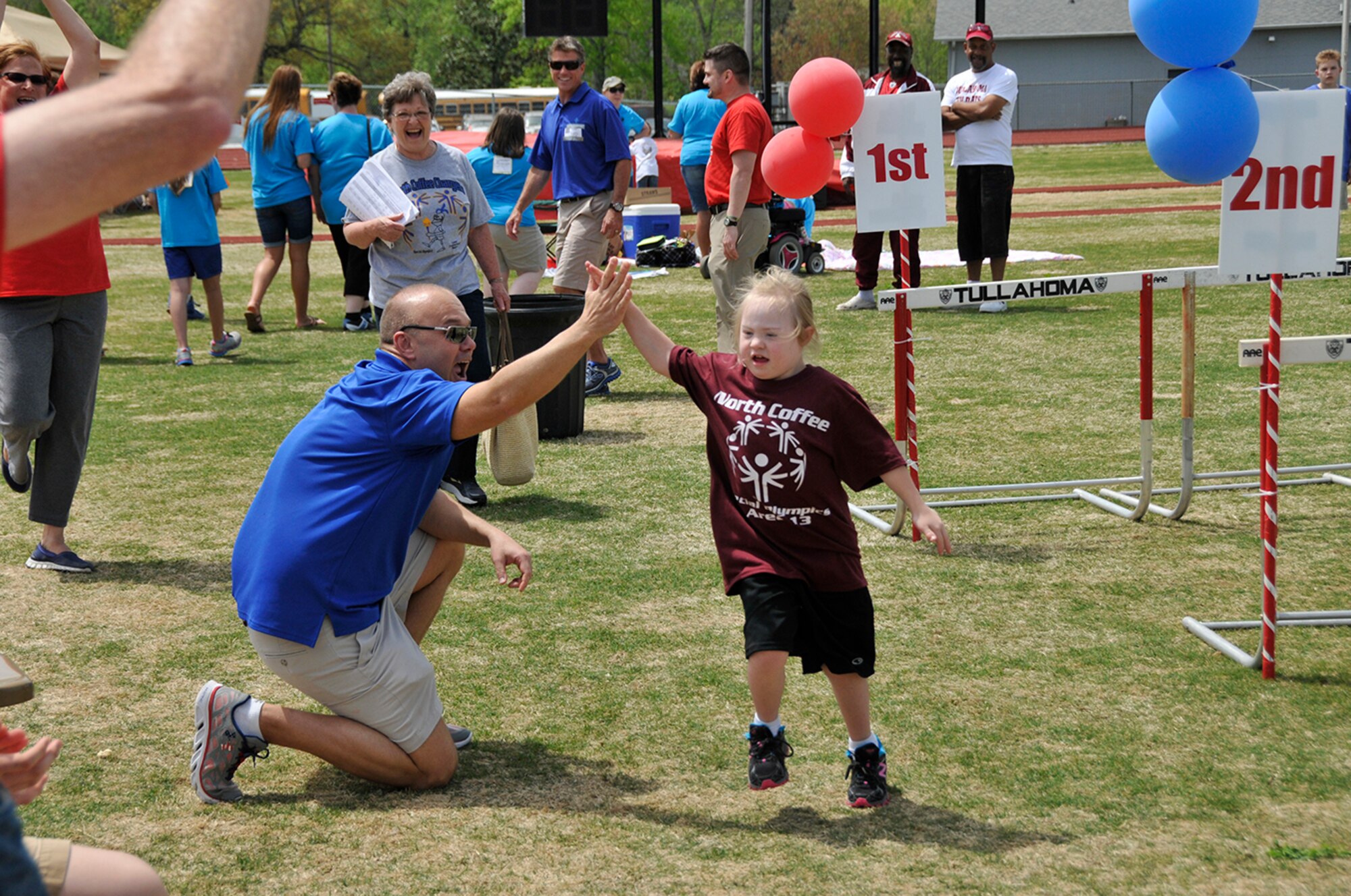AEDC personnel volunteer at the Area 13 Special Olymics on April 24 at the Tullahoma High School stadium. (Photo by Rick Goodfriend)