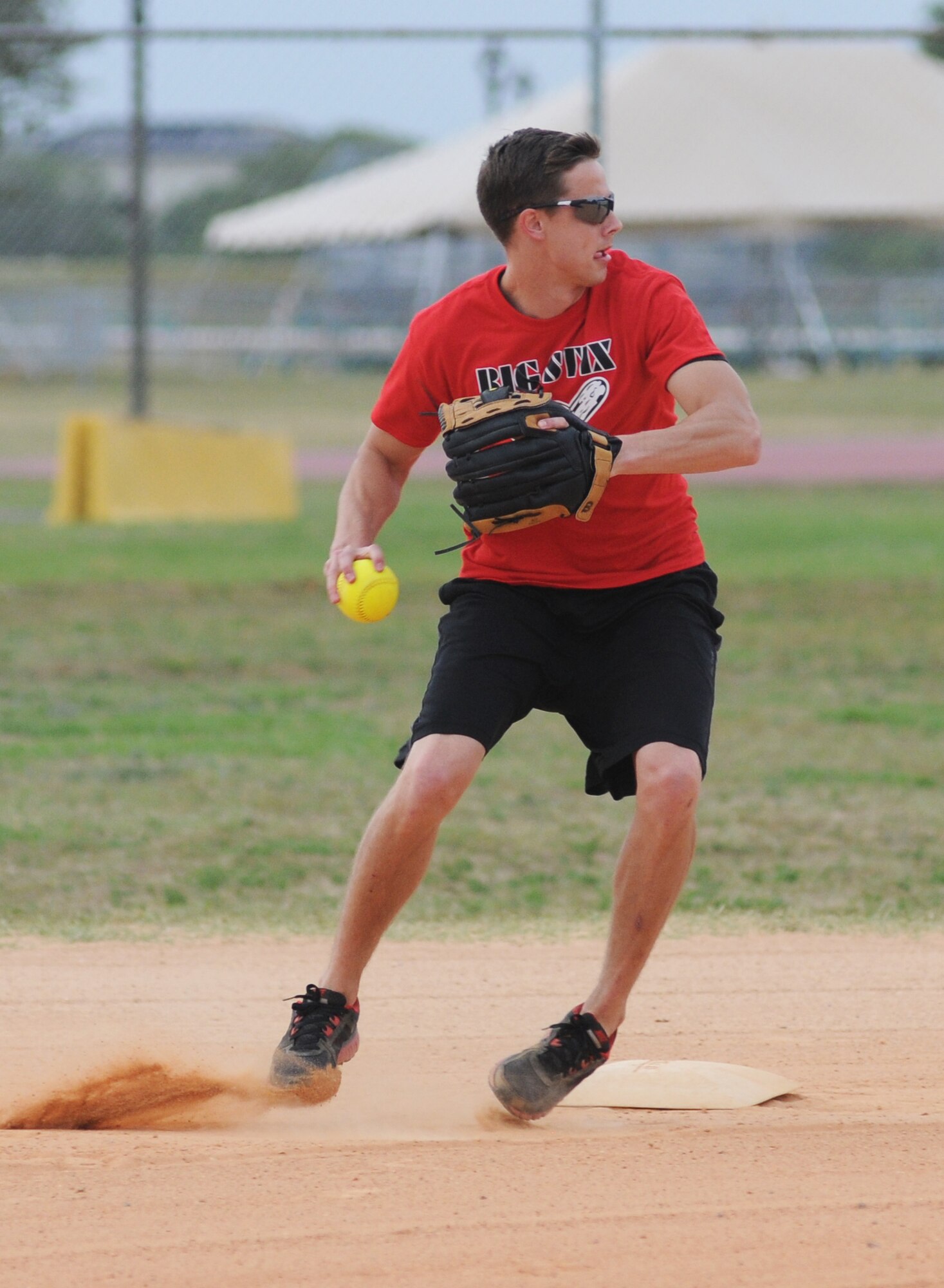 Russell Wians, 81st Surgical Operations Squadron second baseman, prepares to make a throw to first base during an intramural softball game against 81st Contracting Squadron May 8, 2014, at Keesler Air Force Base, Miss.  81st CONS defeated 81st MSGS, 14-5. (U.S. Air Force photo by Kemberly Groue)