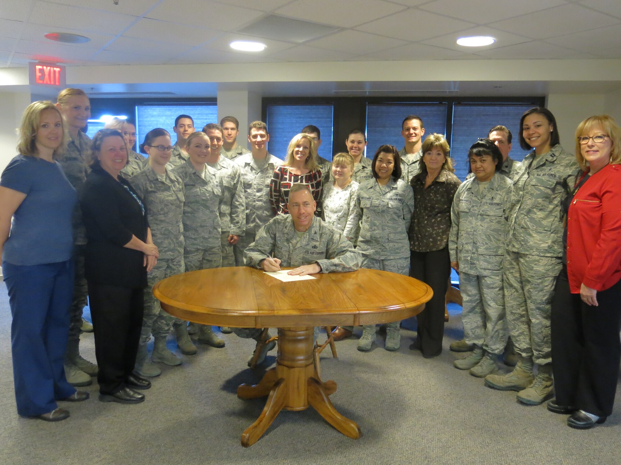 Col. Tom Wilcox, 341st Missile Wing commander (center), signs a proclamation declaring May 6 to 12 Nurse and Medical Technician Appreciation Week at the Malmstrom Air Force Base Clinic on May 5.  Witnessing the signing are nurses and medical technicians from the 341st Medical Group. (Courtesy photo)