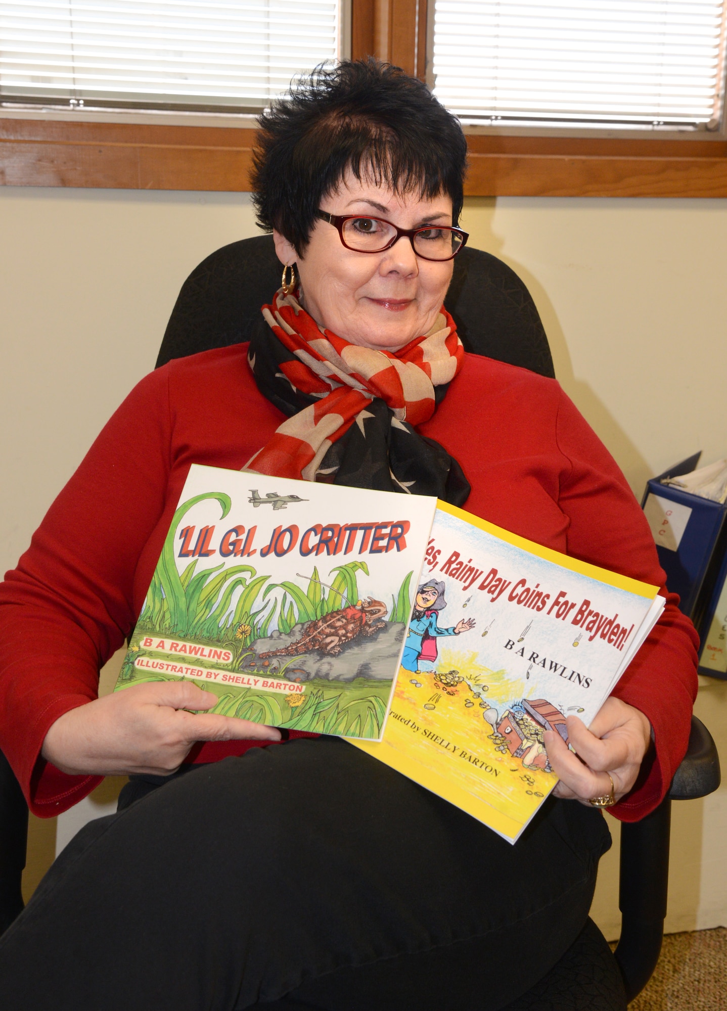 Brenda Rawlins is a government worker by day, children’s author by night. Her latest book, “Lil’ G.I. Jo Critter,” is based on the horned lizards that live at Tinker.  (Air Force photo by Kelly White)