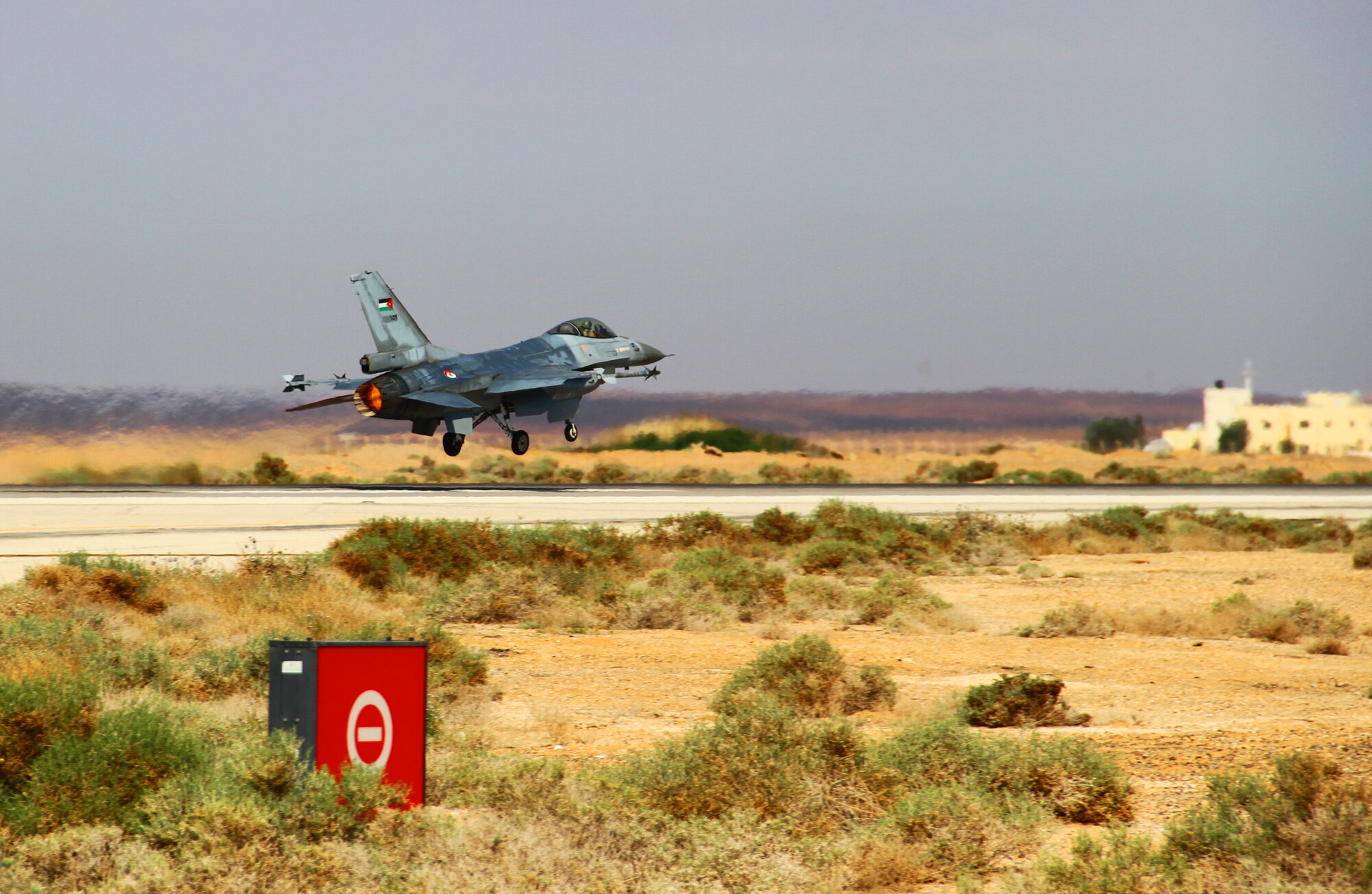 An F-16 Fighting Falcon from the Royal Jordanian Air Force takes off after a scramble exercise conducted during Exercise Eager Tiger May 12, 2014, at an air base in northern Jordan. This exercise helps build tactical proficiency between U.S. and Jordanian forces while also allowing joint training. (U.S. Air Force photo by Staff Sgt. Tyler McLain/Released)