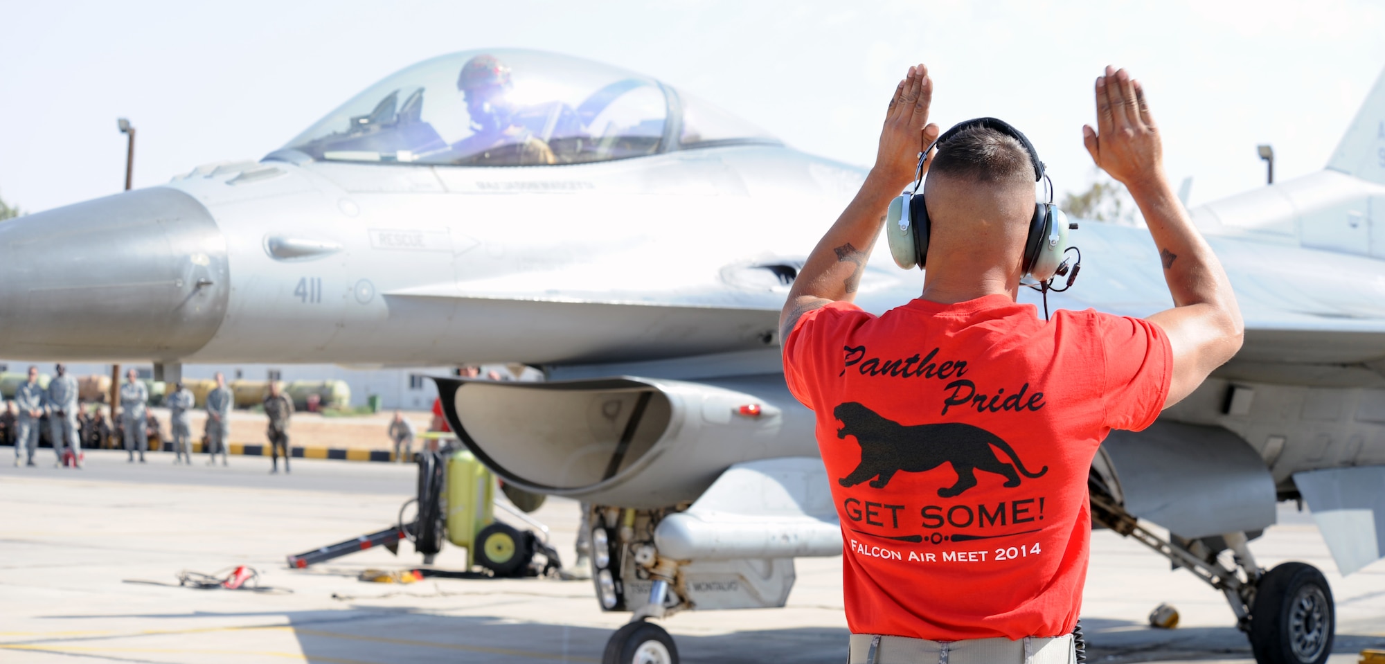 U.S. Air Force Staff Sgt. Hermann Nunez, a crew chief from the 13th Fighter Squadron at Misawa Air Base, Japan, signals to 1st Lt. Dustin Carey, a 13th EFS pilot, before takeoff during Exercise Eager Tiger May 12, 2014, at an air base in northern Jordan. The multinational exercise gave Service members from the U.S. and Jordan a chance to see how each other operates. (U.S. Air Force photo by Staff Sgt. Brigitte N. Brantley/Released)