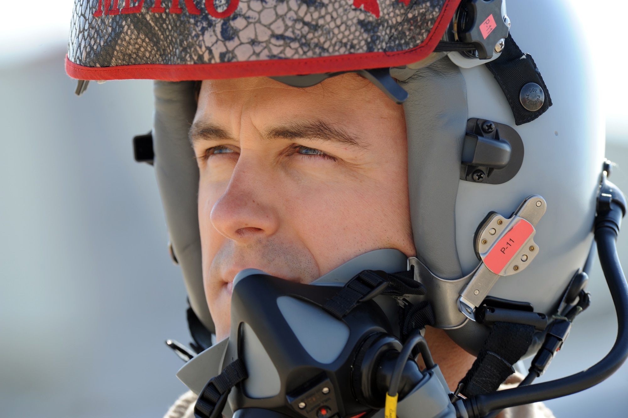 U.S. Air Force Capt. Dennis Muller, a pilot from the 13th Fighter Squadron at Misawa Air Base, Japan, watches competitors during a scramble at Exercise Eager Tiger May 12, 2014, at an air base in northern Jordan. Throughout the exercise, fighter pilots from the U.S. and Jordan flew together multiple times to practice various tactics and techniques. (U.S. Air Force photo by Staff Sgt. Brigitte N. Brantley/Released)