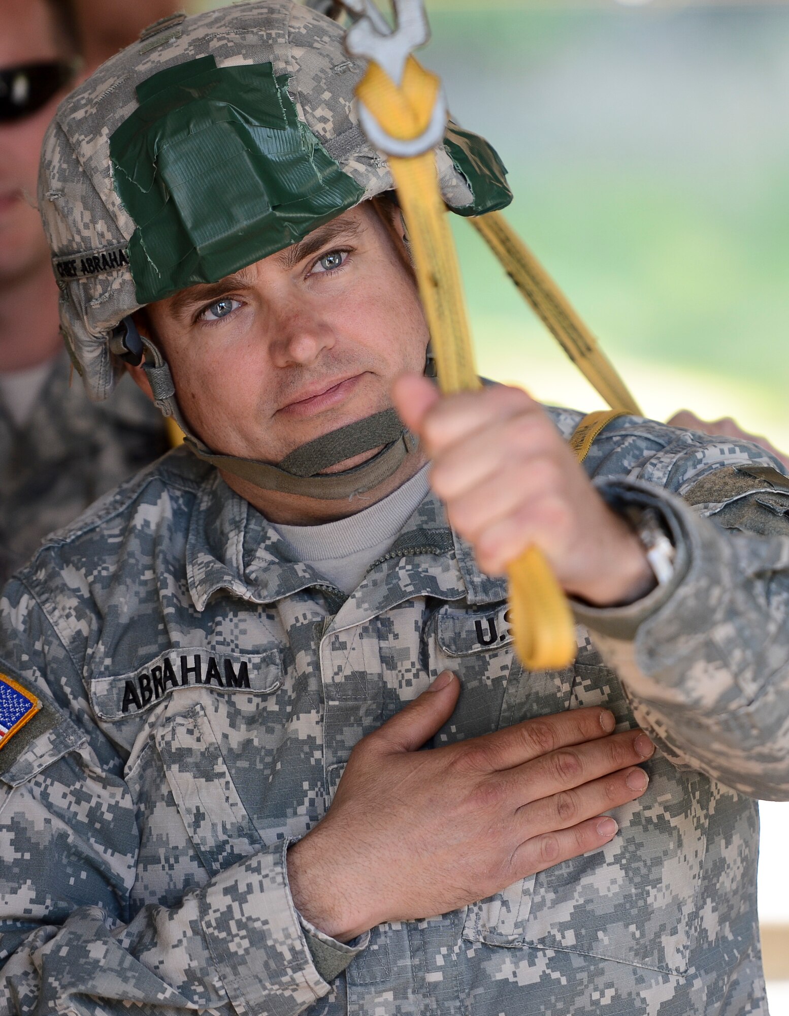 U.S. Army Chief Warrant Officer 3 James Abraham, 1-91st Cavalry Squadron maintenance technician, practices proper aircraft exiting techniques at Rhine Ordinance Barracks, Germany, May 4, 2014. More than 300 jumpers from nine different nations performed a total of 404 static-line jumps and 132 high-altitude low-opening jumps in three days. (U.S. Air Force photo/Airman 1st Class Michael Stuart)