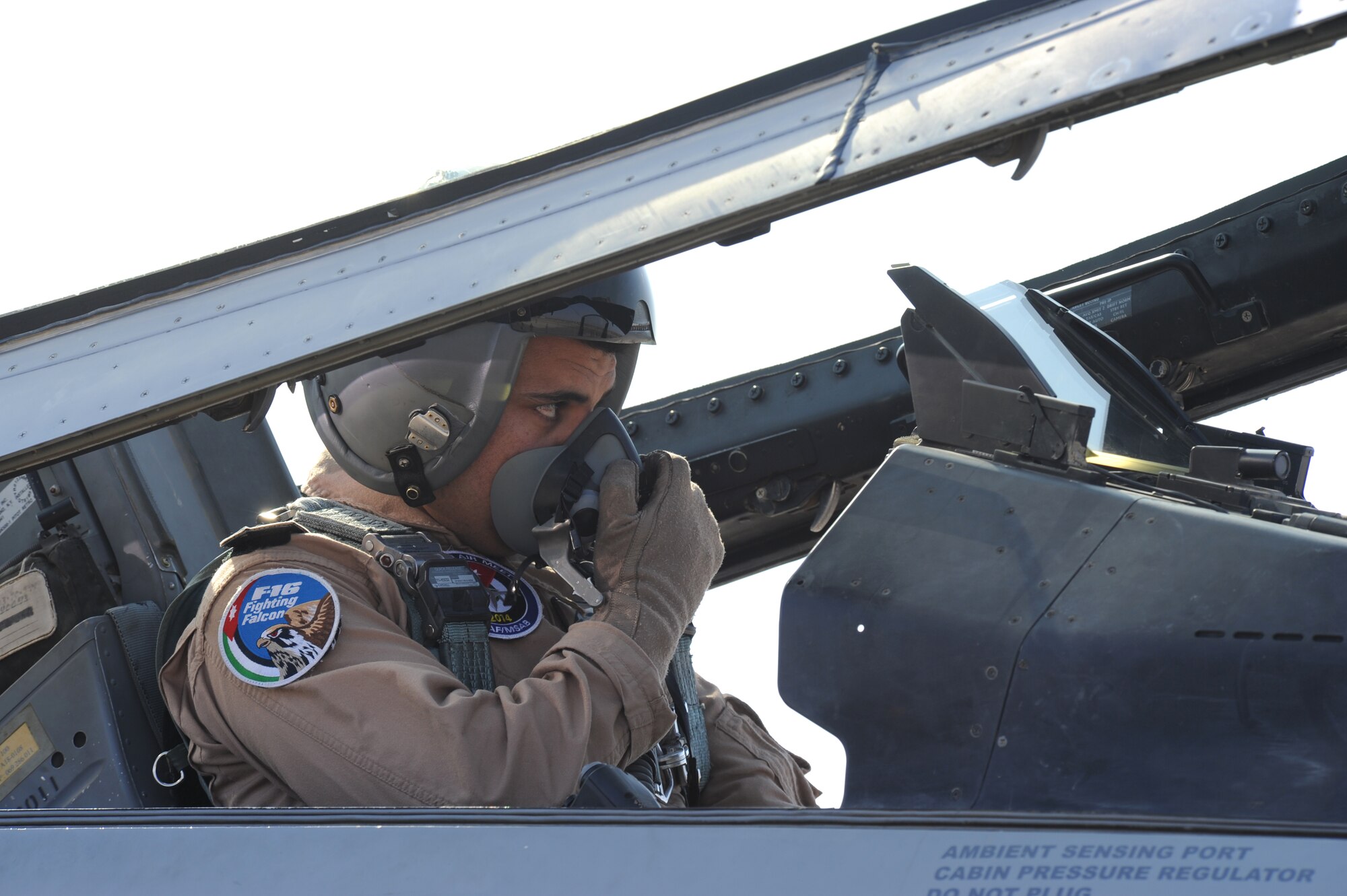 A pilot from the Royal Jordanian Air Force prepares for takeoff during a scramble competition at Exercise Eager Tiger May 12, 2014, at an air base in northern Jordan. After the scramble, pilots from both the U.S. and Jordan took to the sky to participate in joint flying operations. (U.S. Air Force photo by Staff Sgt. Brigitte N. Brantley/Released)