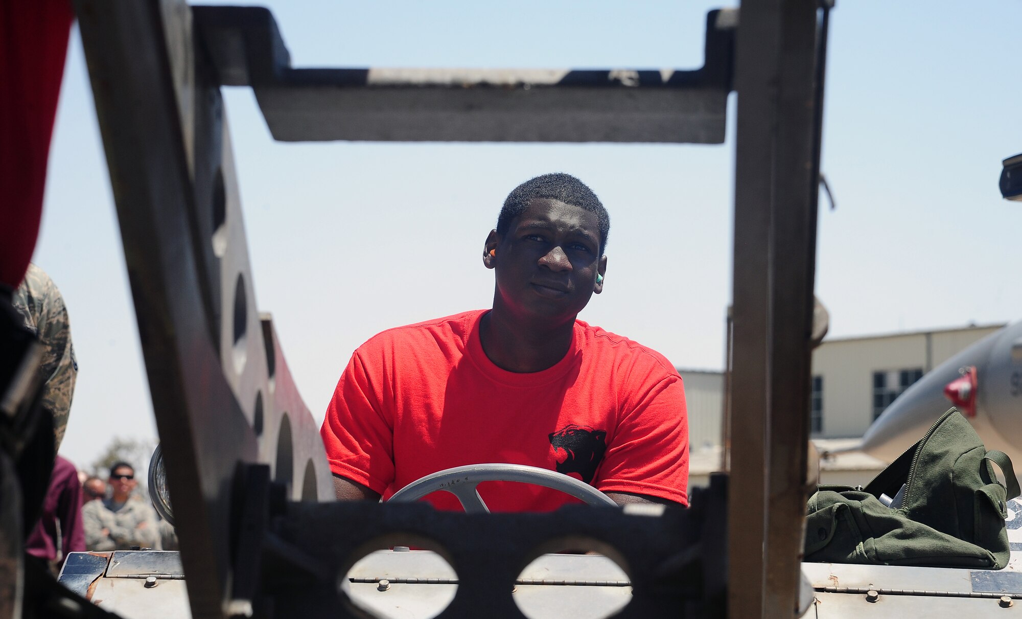 Airman 1st Class Travis Campbell, a weapons loader from the 13th Fighter Squadron at Misawa Air Base, Japan, races to load munitions during a weapons loading competition at Exercise Eager Tiger May 11, 2014, at an air base in northern Jordan. In addition to this competition, Airmen from the squadron will also participate in a scramble competition and a live-fire exercise. (U.S. Air Force photo by Staff Sgt. Brigitte N. Brantley/Released)