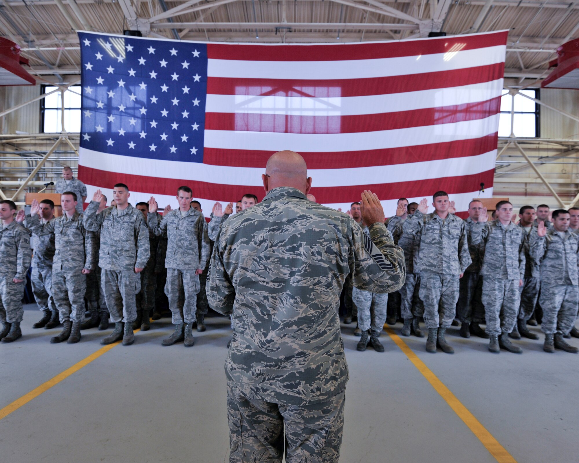 Chief Master Sgt. Charles Miller, 325th Aircraft Maintenance Squadron superintendent, leads 34 newly inducted crew chiefs in the “Maintainers Creed” during the Dedicated Crew Chief Induction Ceremony May 9 at Hanger 2.

The induction ceremony recognizes aircraft maintainers who have earned the title of dedicated crew chief. During the ceremony, each crew chief is paired with a pilot and an aircraft.

“Dedicated crew chiefs are selected based on their initiative, leadership, integrity and technical knowledge,” said Master Sgt. Todd Roberts, 325th AMXS F-22 Raptor production superintendent. “A crew chief is in charge of their assigned aircraft and is responsible for all maintenance, appearance and discrepancies associated with their aircraft.”(U.S. Air Force photo by Tech. Sgt. Javier Cruz)
