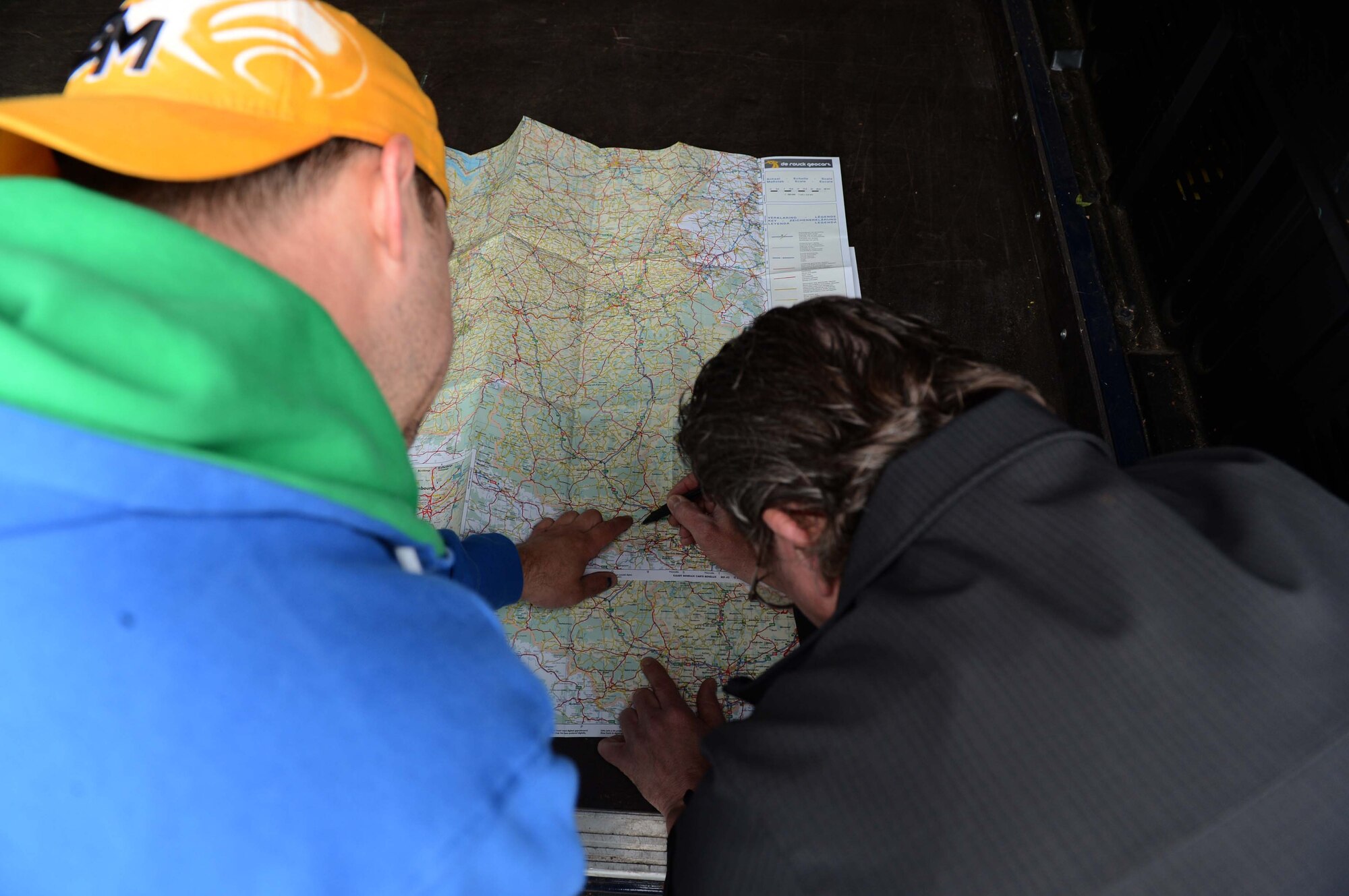 Anthony Williams, 52nd Force Support Squadron outdoor recreation director, and Robert Taylor, 52nd Force Support Squadron outdoor recreation staff member from Pittsburg, circle the checkpoints for the Eifel-to-Eiffel bicycle ride along the route to Paris, May 8, 2014. Williams and Taylor provided support for the riders during their journey. (U.S. Air Force photo by Airman 1st Class Kyle Gese/Released)