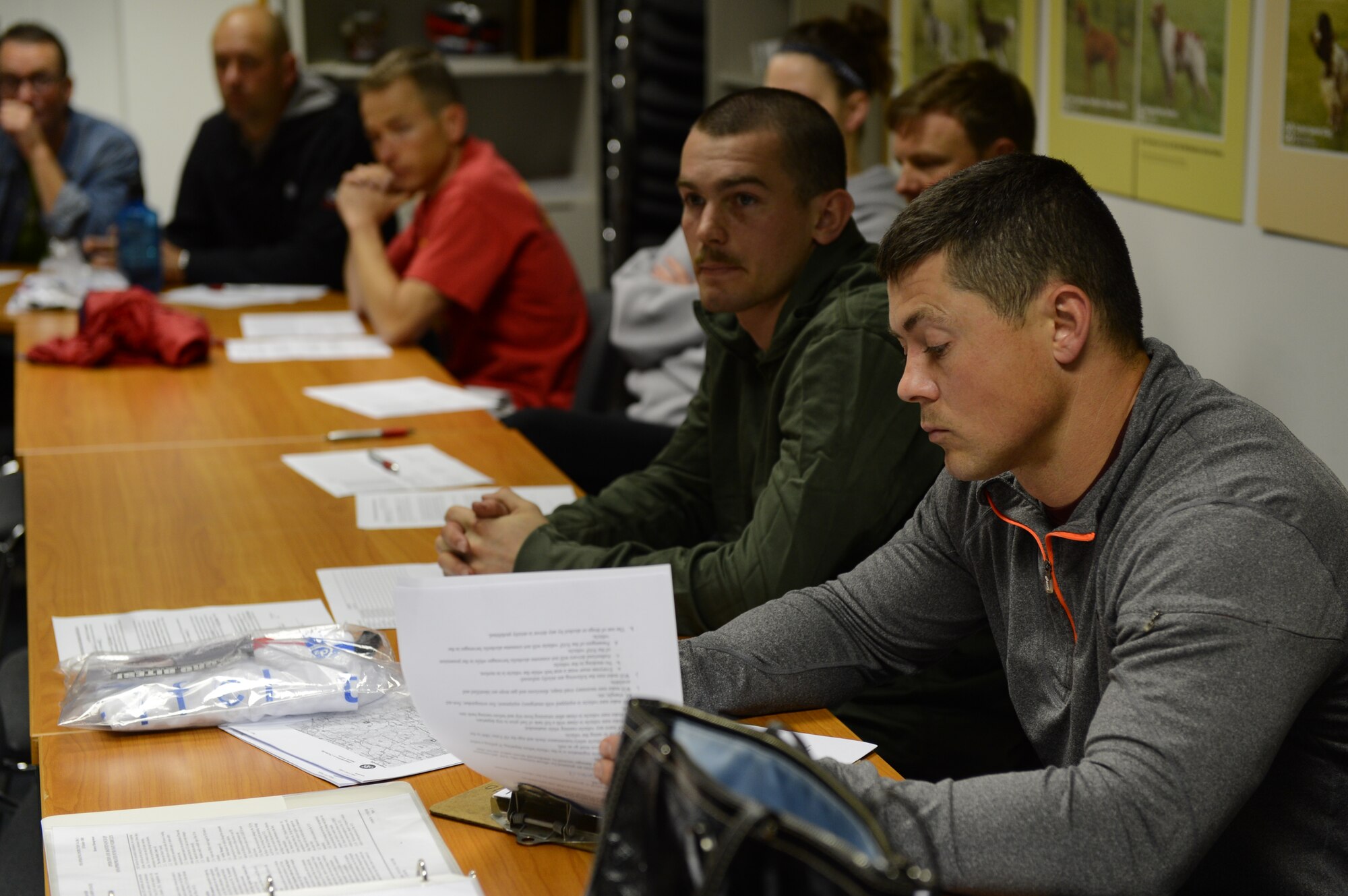 David Esra, 52nd Force Support Squadron combat fitness programs manager from Jackson, Tenn., looks over itineraries and maps for the Eifel to Eiffel bicycle trip at Spangdahlem Air Base, Germany, May 7, 2014. Esra drove one of the support vehicles for Airmen and civilians who biked from the Eifel region to the Eiffel Tower. (U.S. Airmen 1st Kyle Gese/Released)